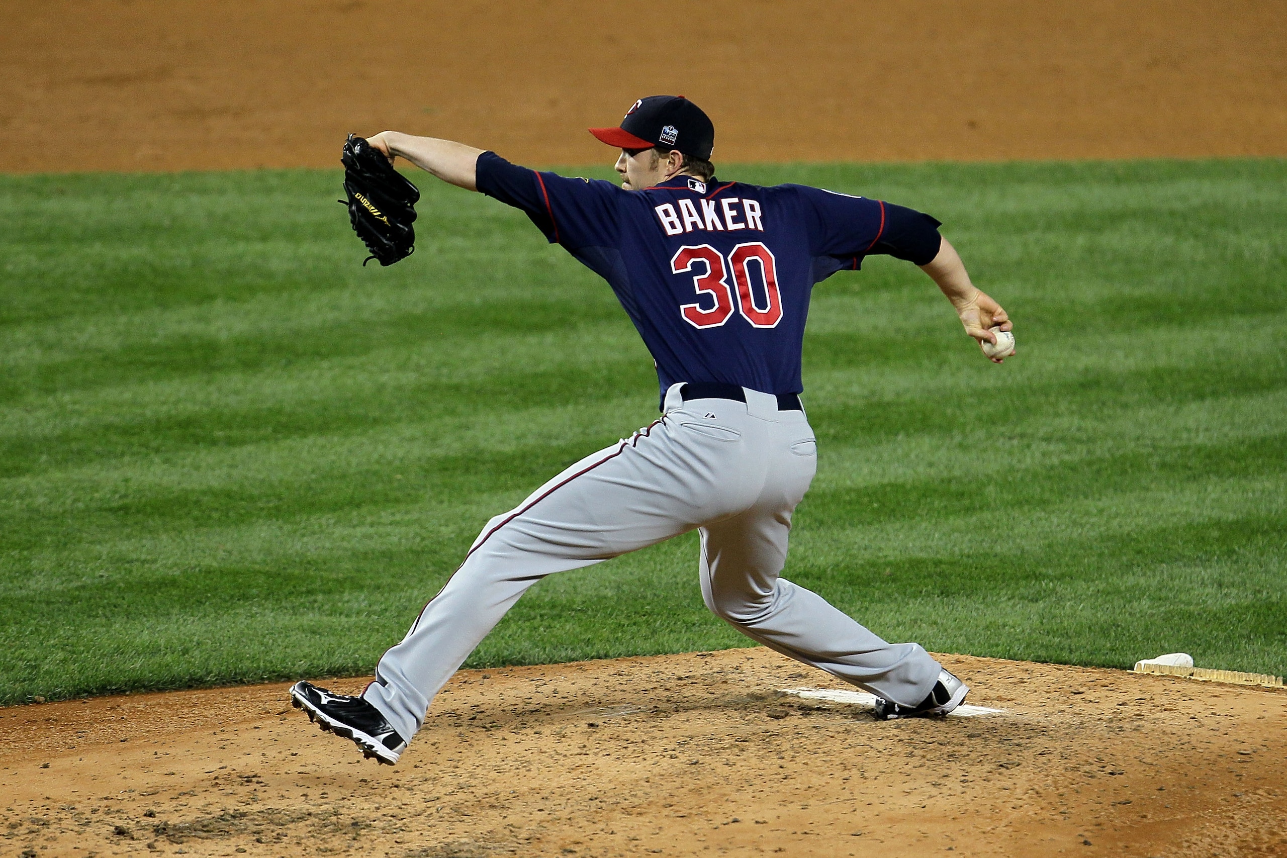 NEW YORK - OCTOBER 09:  Scott Baker #30 of the Minnesota Twins throws a pitch against the New York Yankees during Game Three of the ALDS part of the 2010 MLB Playoffs at Yankee Stadium on October 9, 2010 in the Bronx borough of New York City.  (Photo by C