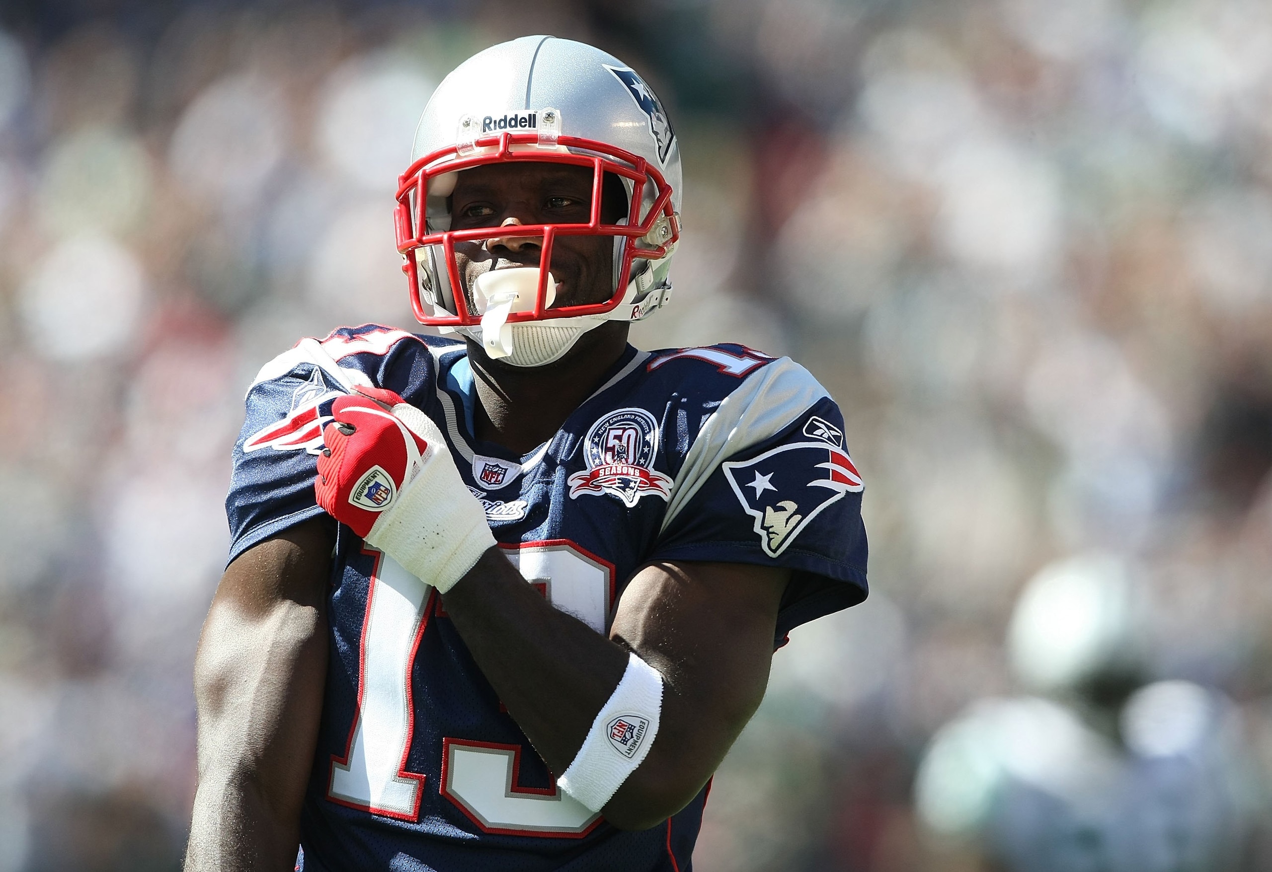 EAST RUTHERFORD, NJ - SEPTEMBER 20: Joey Galloway #13 of the New England Patriots grabs his jersey against the New York Jets at Giants Stadium on September 20, 2009 in East Rutherford, New Jersey. (Photo by Nick Laham/Getty Images) EAST RUTHERFORD, NJ - SEPTEMBER 20: Joey Galloway #13 of the New England Patriots grabs his jersey against the New York Jets at Giants Stadium on September 20, 2009 in East Rutherford, New Jersey. (Photo by Nick Laham/Getty Images)