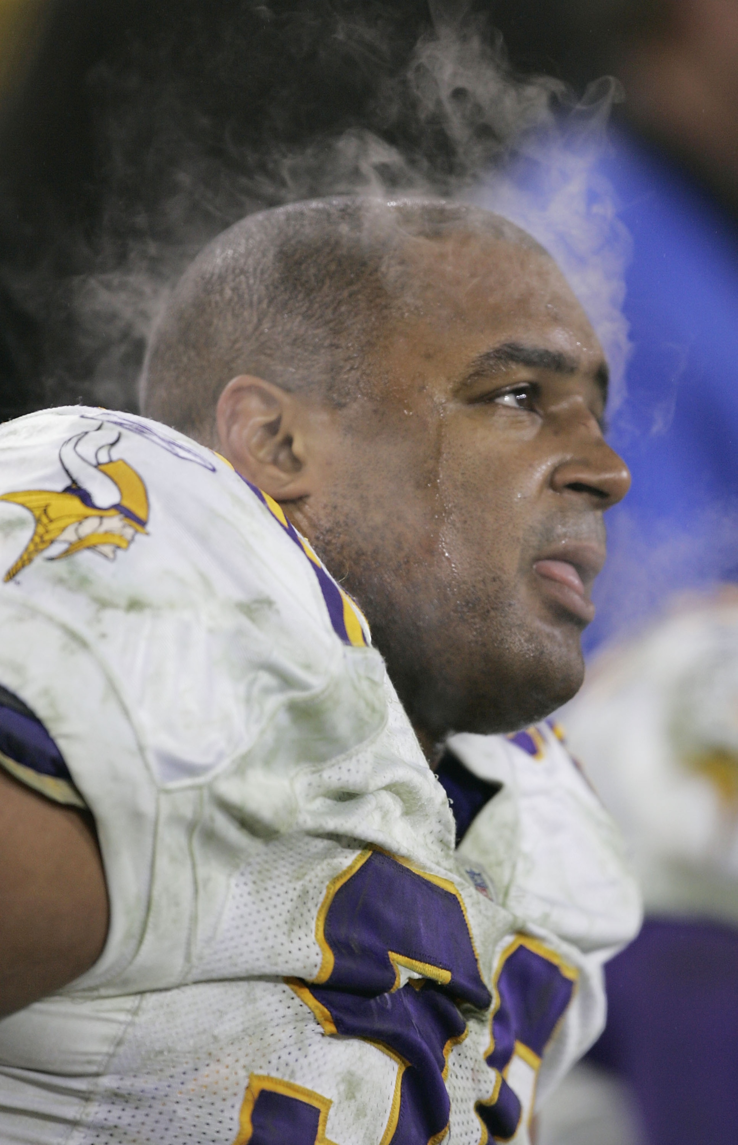 GREEN BAY, WI - JANUARY 9: Nose tackle Steve Martin #90 of the Minnesota Vikings sits on the sidelines as his team takes on the Green Bay Packers in the NFC wild-card game at Lambeau Field on January 9, 2005 in Green Bay, Wisconsin. The Vikings defeated GREEN BAY, WI - JANUARY 9: Nose tackle Steve Martin #90 of the Minnesota Vikings sits on the sidelines as his team takes on the Green Bay Packers in the NFC wild-card game at Lambeau Field on January 9, 2005 in Green Bay, Wisconsin. The Vikings defeated