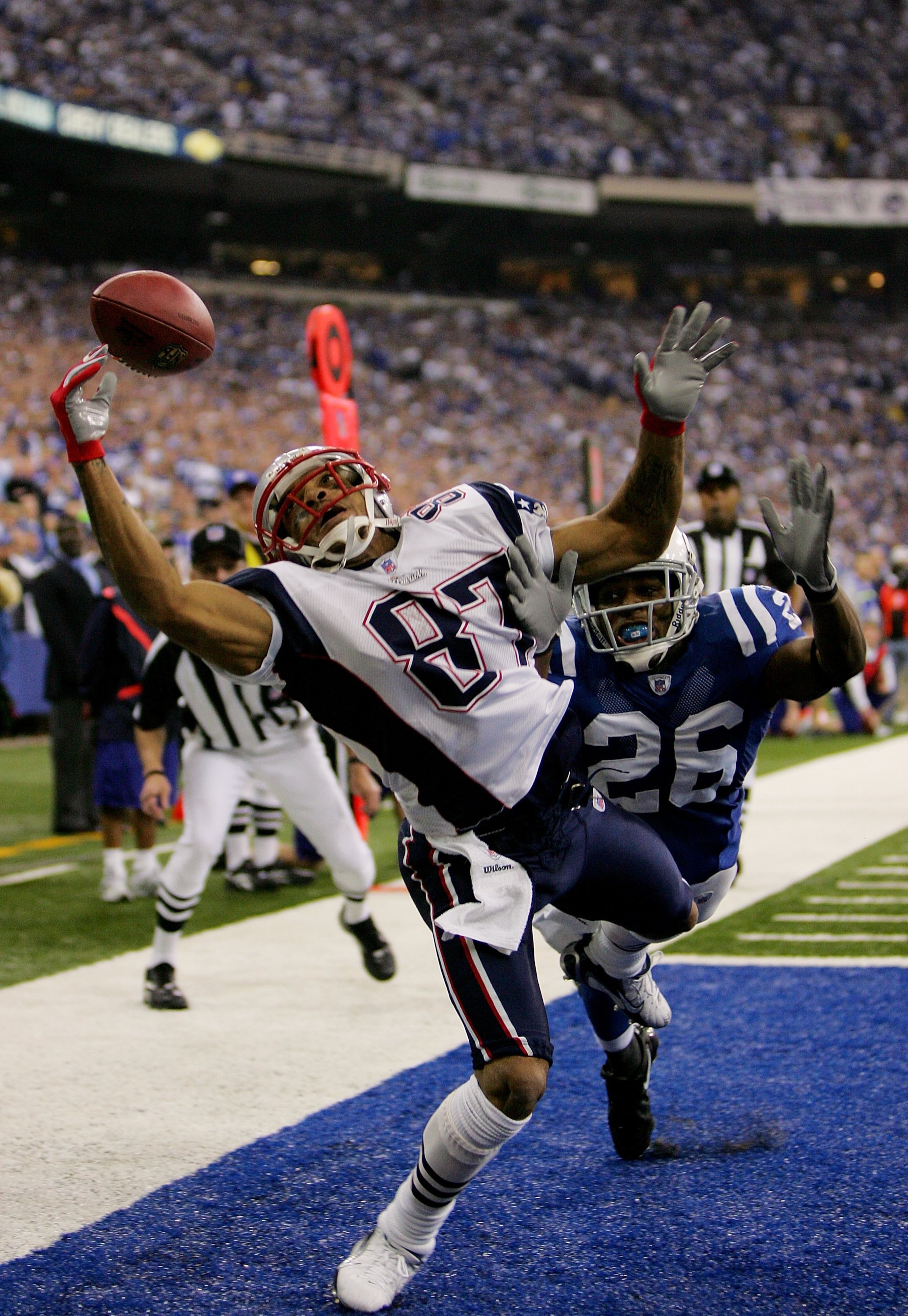 INDIANAPOLIS - JANUARY 21: Reche Caldwell #87 of the New England Patriots cannot haul in this pass in front of Kelvin Hayden #26 of the Indianapolis Colts during the AFC Championship Game on January 21, 2007 at the RCA Dome in Indianapolis, Indiana. (Ph INDIANAPOLIS - JANUARY 21: Reche Caldwell #87 of the New England Patriots cannot haul in this pass in front of Kelvin Hayden #26 of the Indianapolis Colts during the AFC Championship Game on January 21, 2007 at the RCA Dome in Indianapolis, Indiana. (Ph