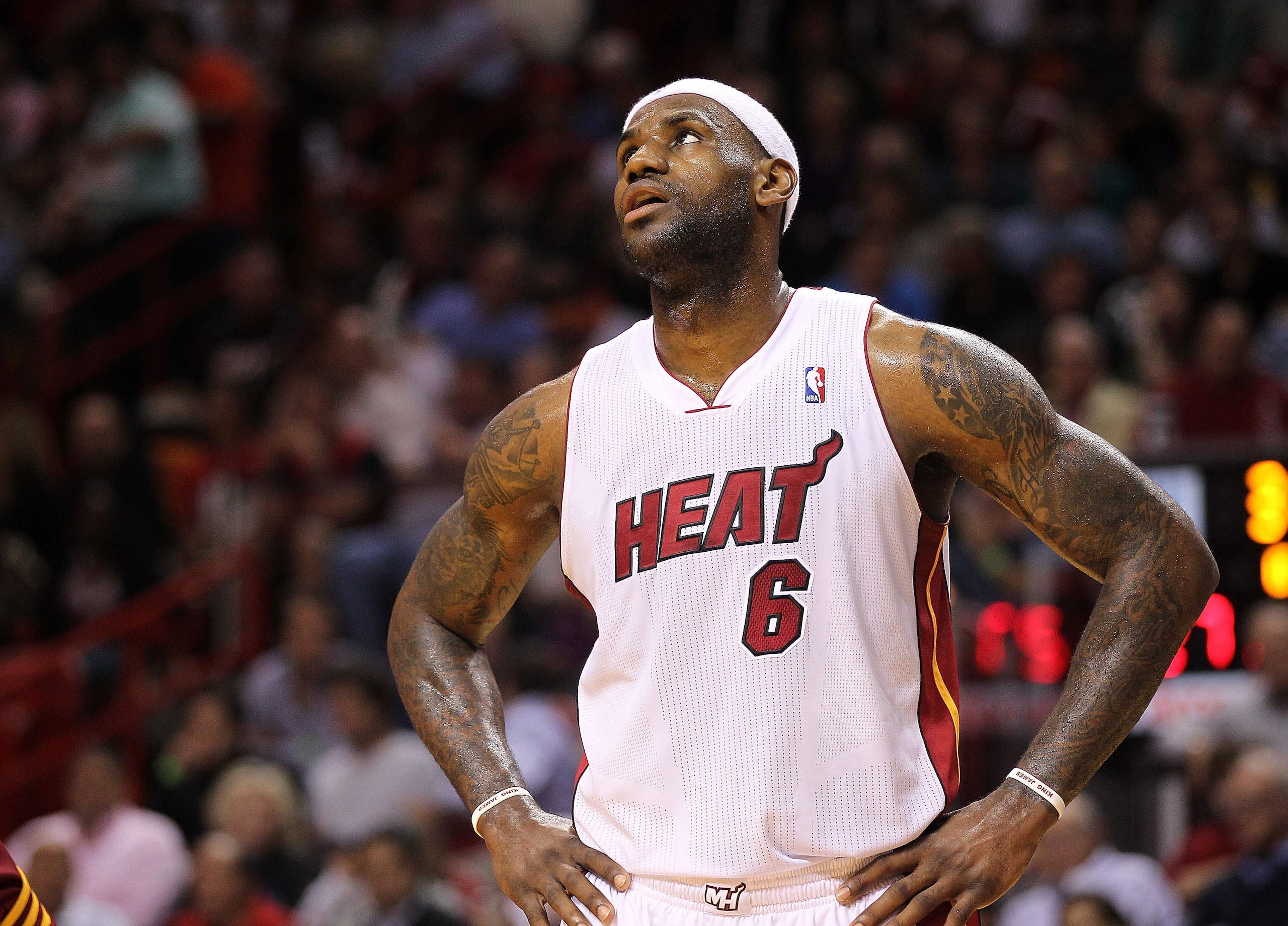 MIAMI, FL - JANUARY 31:  LeBron James #6 of the Miami Heat looks on during a game against the Cleveland Cavaliers at American Airlines Arena on January 31, 2011 in Miami, Florida. NOTE TO USER: User expressly acknowledges and agrees that, by downloading a