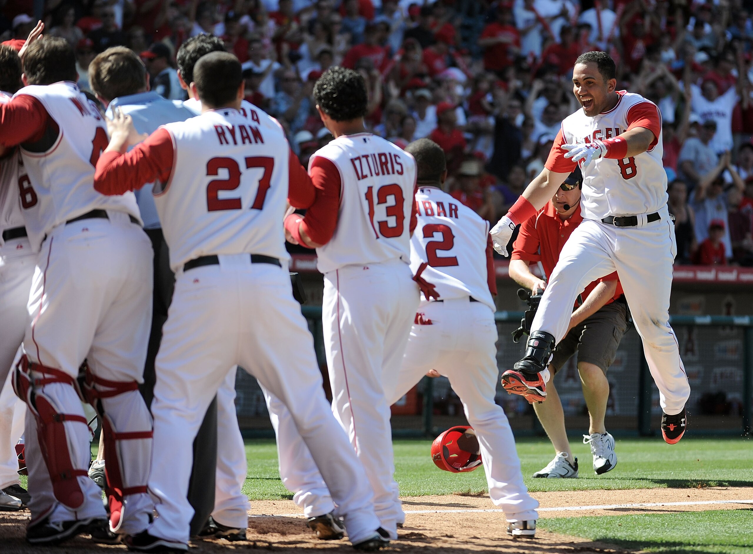 ANAHEIM, CA - MAY 29:  Kendry Morales #8 of the Los Angeles Angels celebrates his grand slam homerun to win the game 5-1 over the Seattle Mariners during the bottom of the ninth inning at Angel Stadium on May 29, 2010 in Anaheim, California.  (Photo by Ha