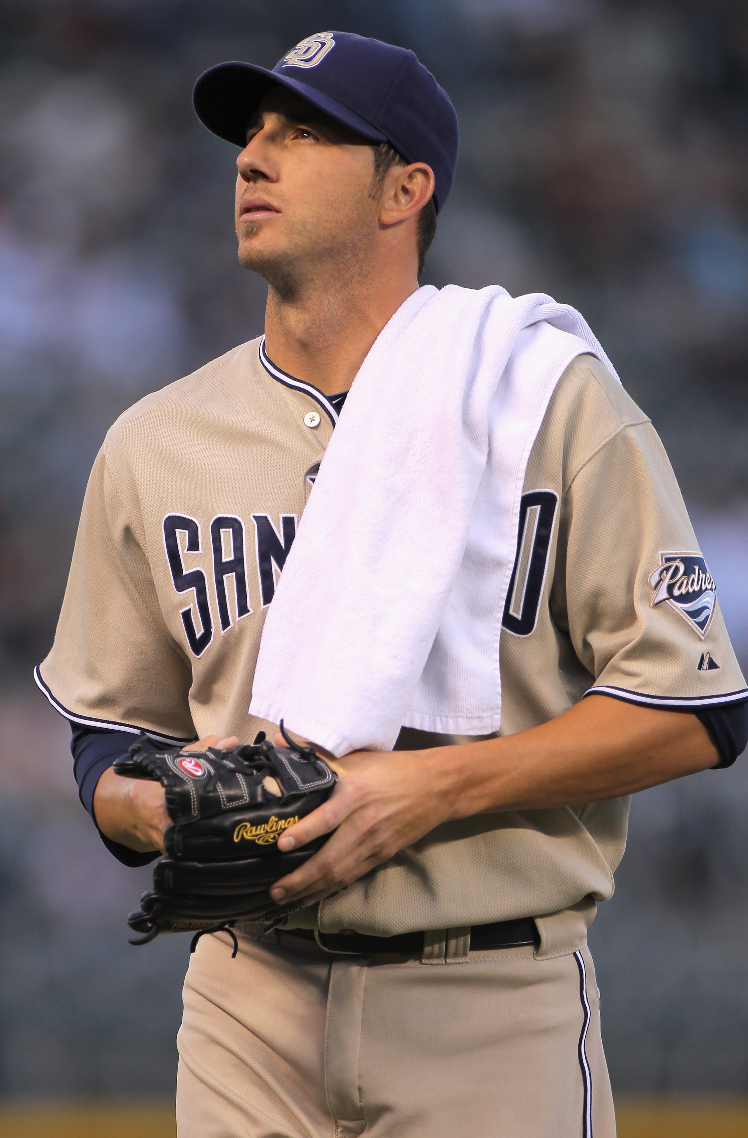 DENVER - SEPTEMBER 14:  Starting pitcher Jon Garland #27 of the San Diego Padres heads for the dugout prior to facing the Colorado Rockies at Coors Field on September 14, 2010 in Denver, Colorado. Garland earned he win as the Padres defeated the Rockies 7