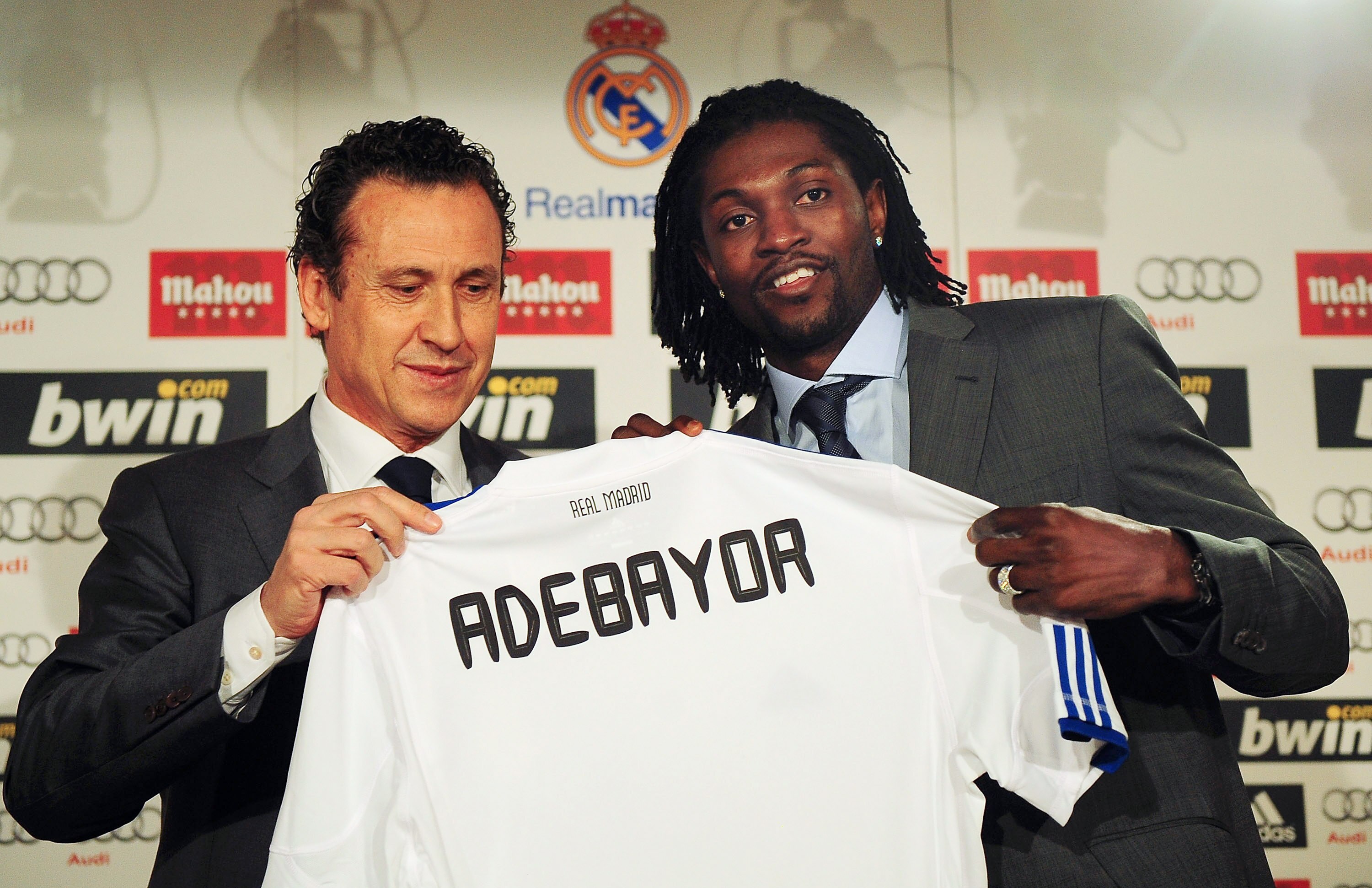 MADRID, SPAIN - JANUARY 27: Jorge Valdano (L) Real Madrid's director general presents  Emmanuel Adebayor with his new Real Madrid shirt during his presentation as a new Real player at Estadio Santiago Bernabeu on January 27, 2011 in Madrid, Spain.  (Photo