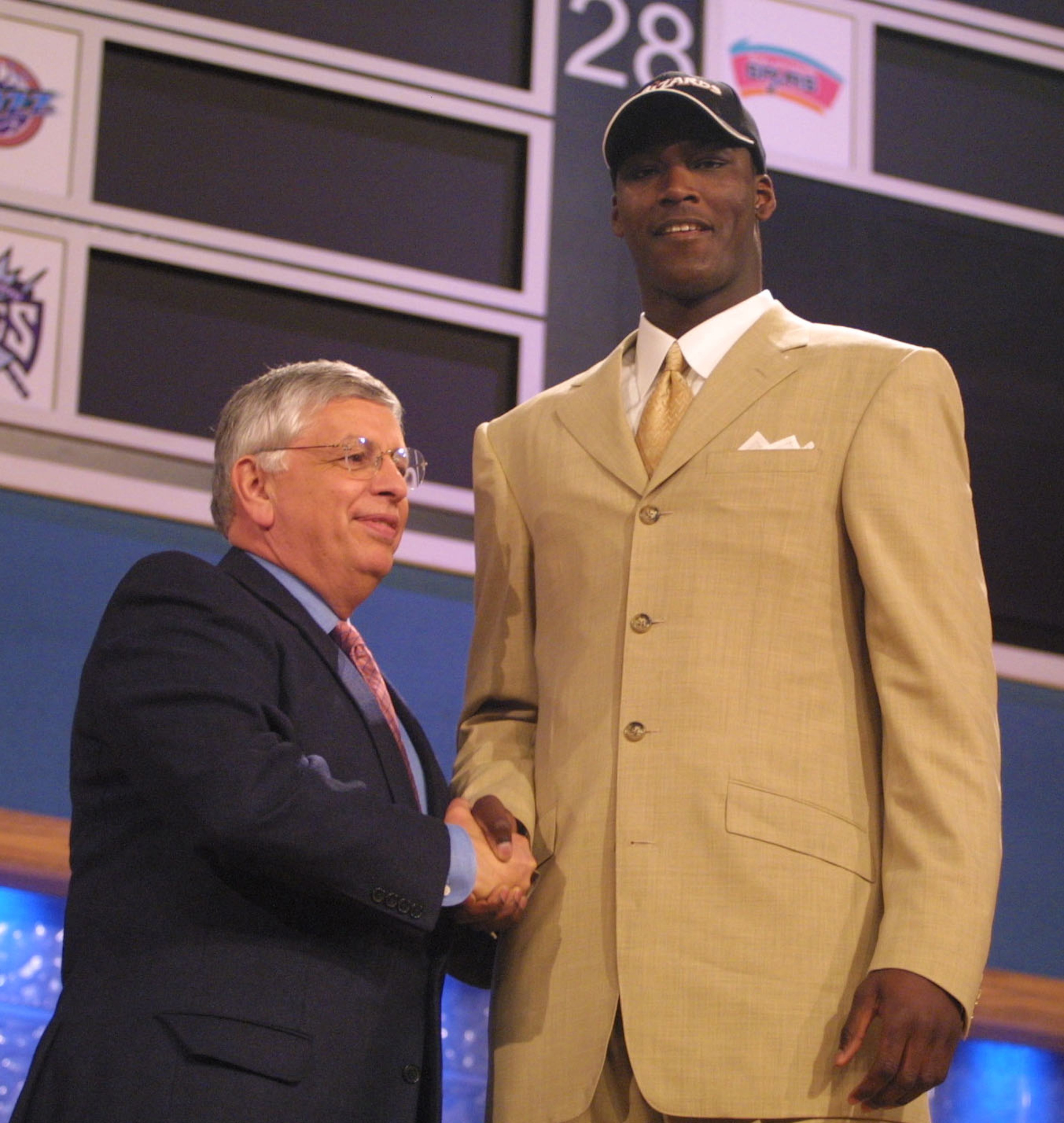 27 Jun 2001: NBA Commisioner David Stern congratulates Kwame Brown of Glynn Acadamy in Georgia, after being the first pick in the NBA Draft by the Washington Wizards at the Theatre in Madison Square Garden, New York City. Mandatory Credit: Al Bello/ALLSP 27 Jun 2001: NBA Commisioner David Stern congratulates Kwame Brown of Glynn Acadamy in Georgia, after being the first pick in the NBA Draft by the Washington Wizards at the Theatre in Madison Square Garden, New York City. Mandatory Credit: Al Bello/ALLSP