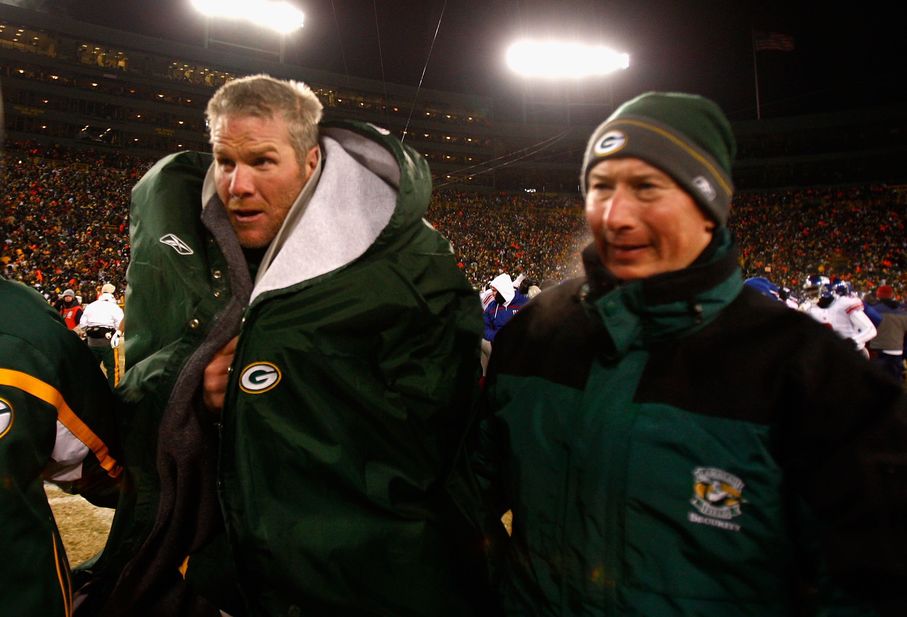 GREEN BAY, WI - JANUARY 20:  Quarterback Brett Favre #4 of the Green Bay Packers walks off the field with former Packer Hall of Famer Bart Star after the NFC championship game against the New York Giants on January 20, 2008 at Lambeau Field in Green Bay,