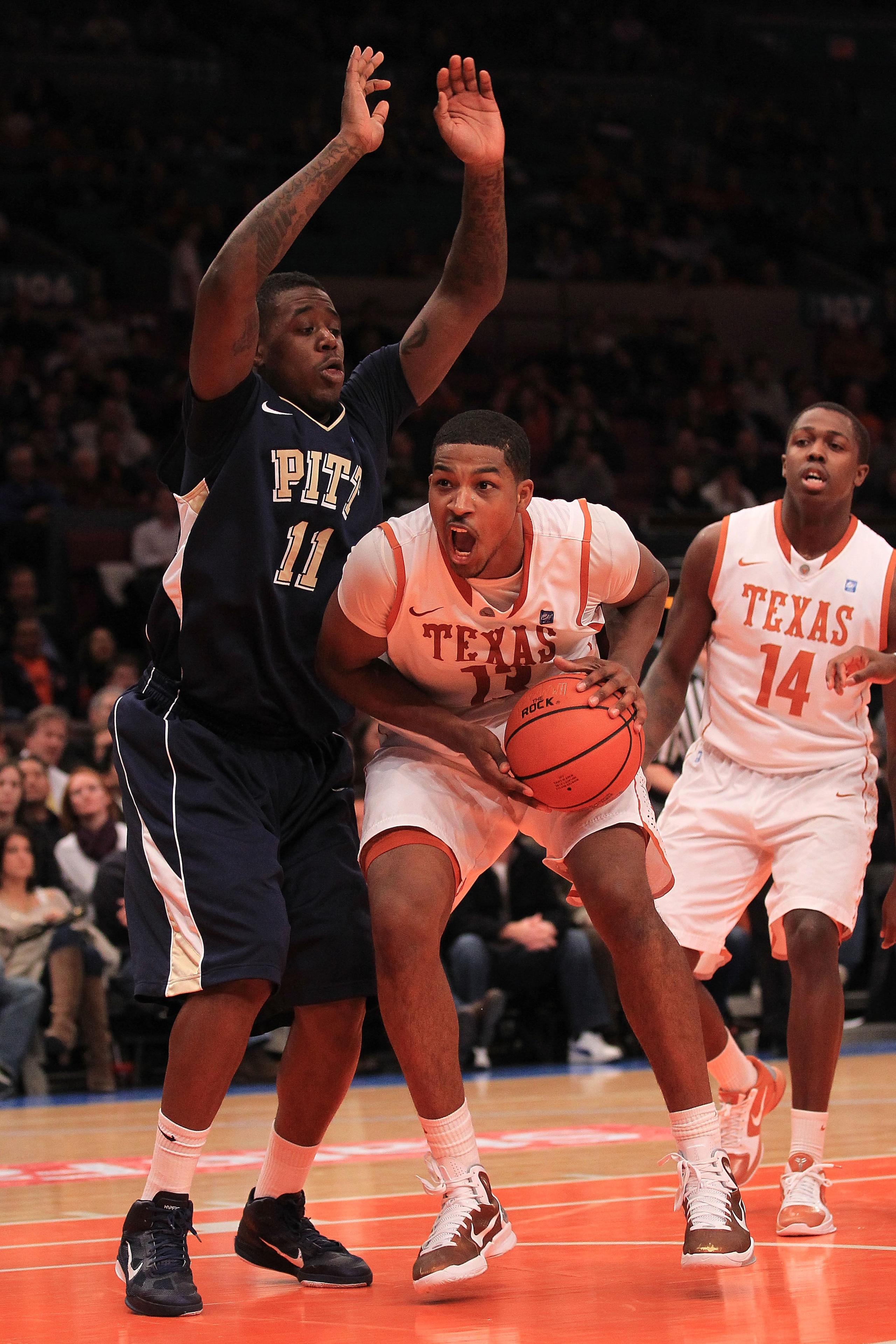 NEW YORK - NOVEMBER 19: Tristan Thompson #13 of the Texas Longhorns fakes out Dante Taylor #11  of the Pittsburgh Panthers during the Championship game of the 2k Sports Classic at Madison Square Garden on November 19, 2010 in New York, New York.  (Photo b