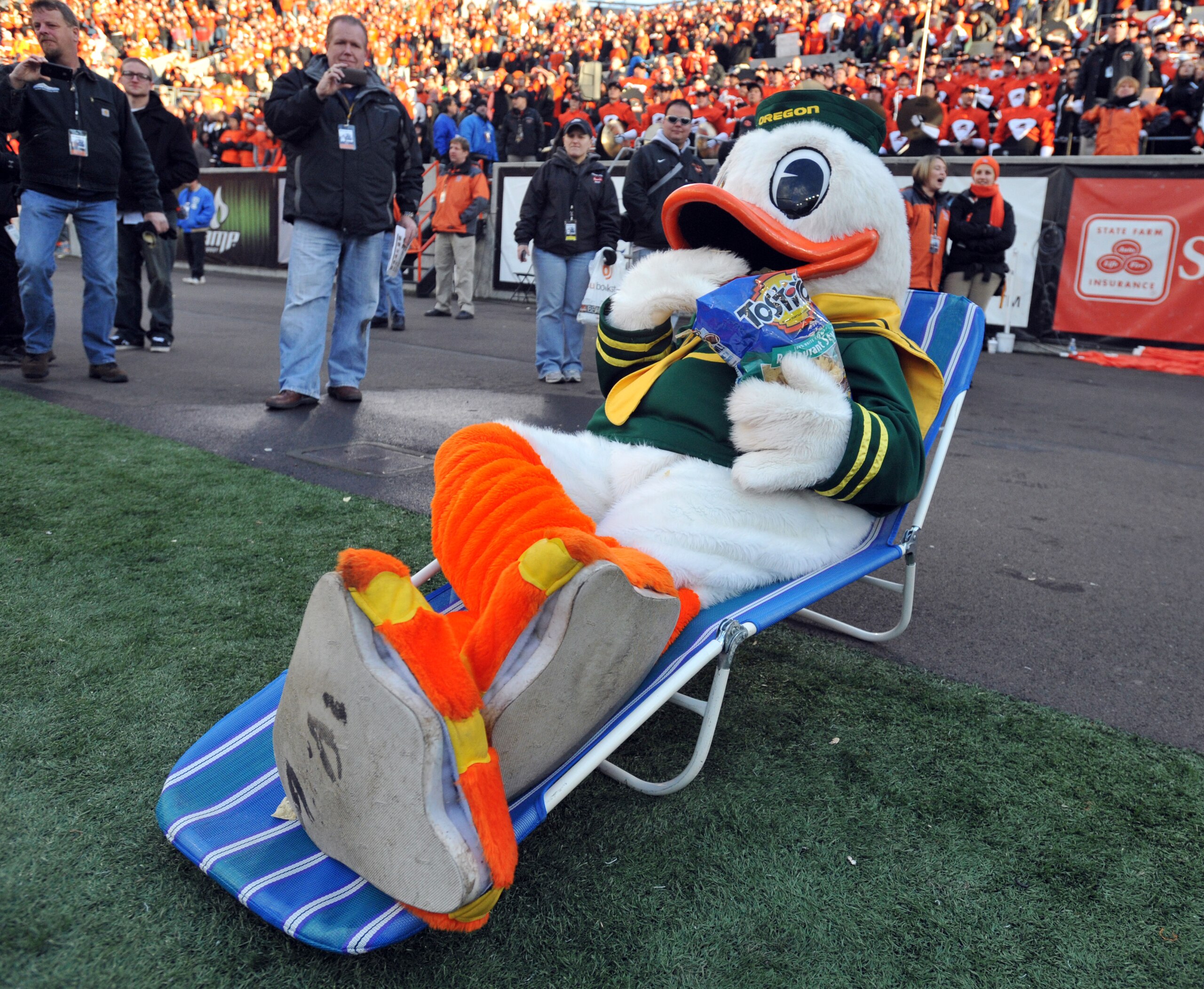 CORVALLIS, OR - DECEMBER 4: Oregon Ducks mascot 'Puddles' sits in a lawn chair and eats Tostitos chips as time winds down in the fourth quarter of the game against the Oregon State Beavers at Reser Stadium on December 4, 2010 in Corvallis, Oregon. The Duc