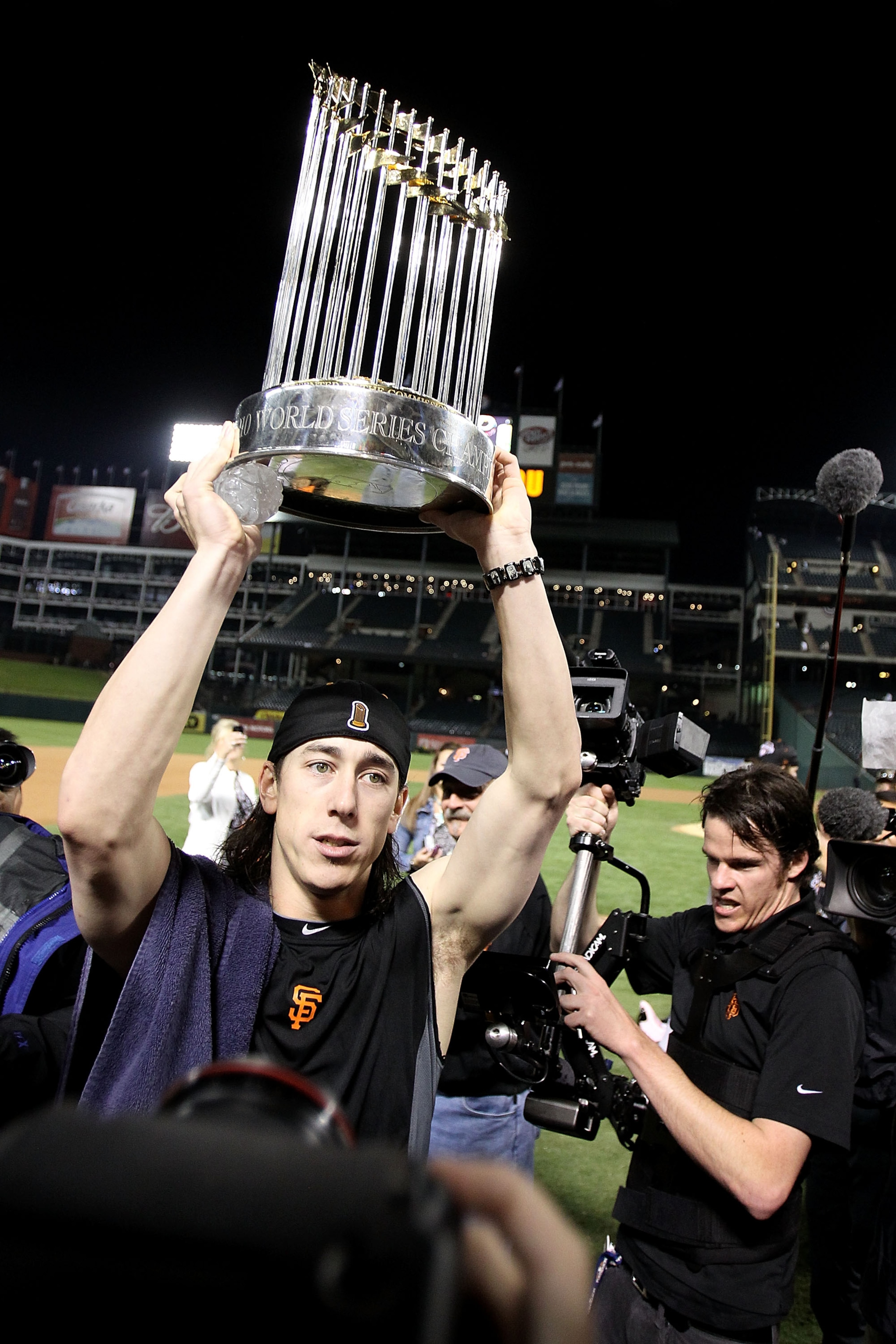 ARLINGTON, TX - NOVEMBER 01:  Tim Lincecum of the San Francisco Giants celebrates with the World Series Championship trophy after the Giants won 3-1 the Texas Rangers in Game Five of the 2010 MLB World Series at Rangers Ballpark in Arlington on November 1