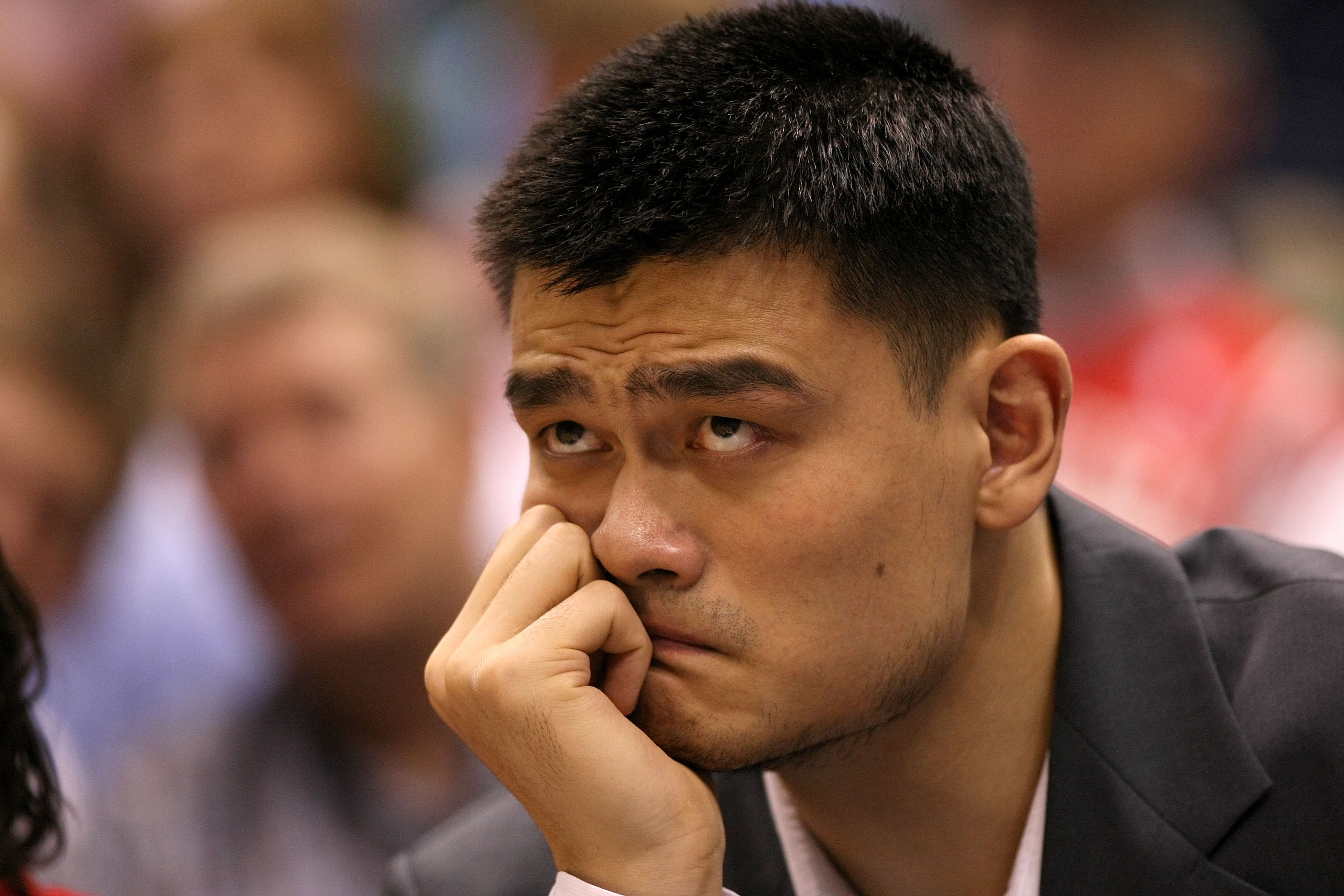 SALT LAKE CITY - MAY 02: Yao Ming #11 of the Houston Rockets shows his dejection as he sits injured on the bench against the Utah Jazz in Game Six of the Western Conference Quarterfinals during the 2008 NBA Playoffs at Energy Solutions Arena on May 2, 200
