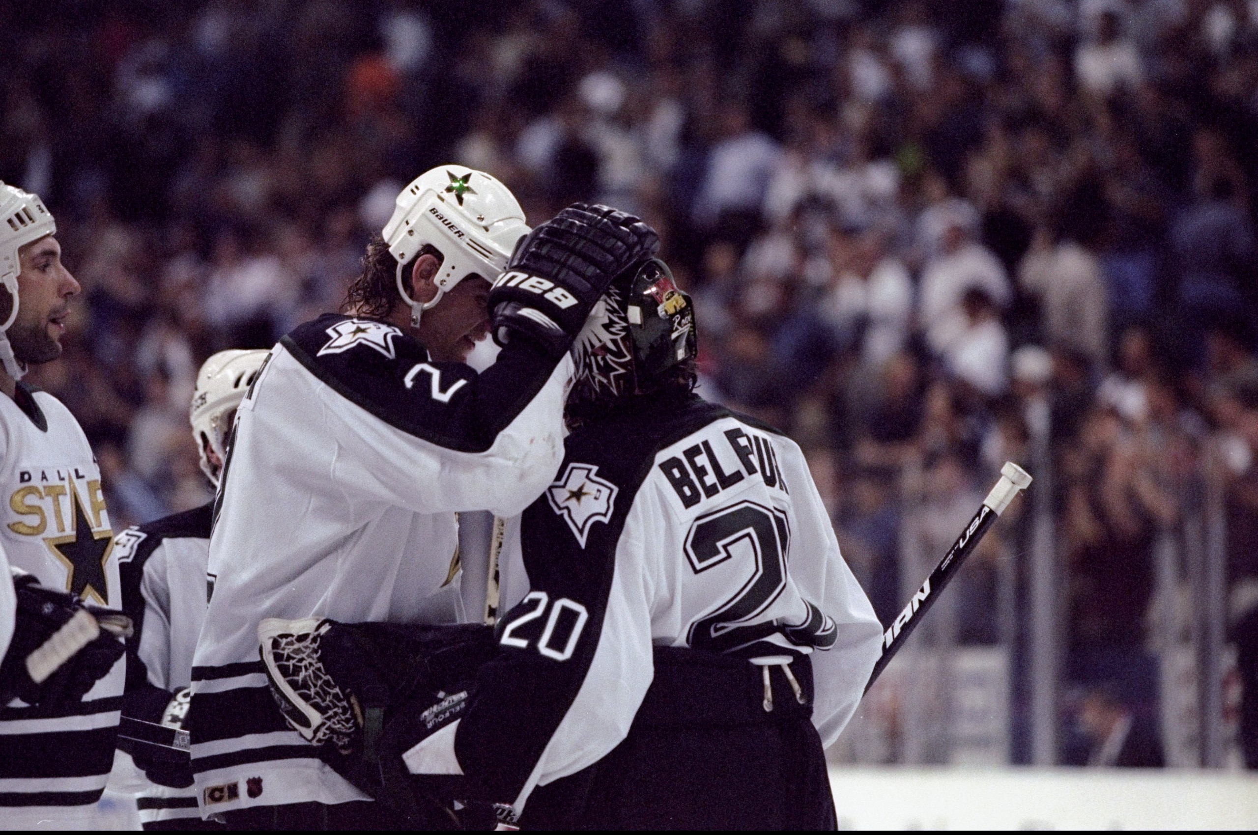 24 Apr 1998: Defenseman Derian Hatcher of the Dallas Stars (left) hugs teammate goaltender Ed Belfour during the Western Conference Playoffs 1st round game against the San Jose Sharks at the Reunion Arena in Dallas, Texas. The Stars defeated the Sharks 5 24 Apr 1998: Defenseman Derian Hatcher of the Dallas Stars (left) hugs teammate goaltender Ed Belfour during the Western Conference Playoffs 1st round game against the San Jose Sharks at the Reunion Arena in Dallas, Texas. The Stars defeated the Sharks 5