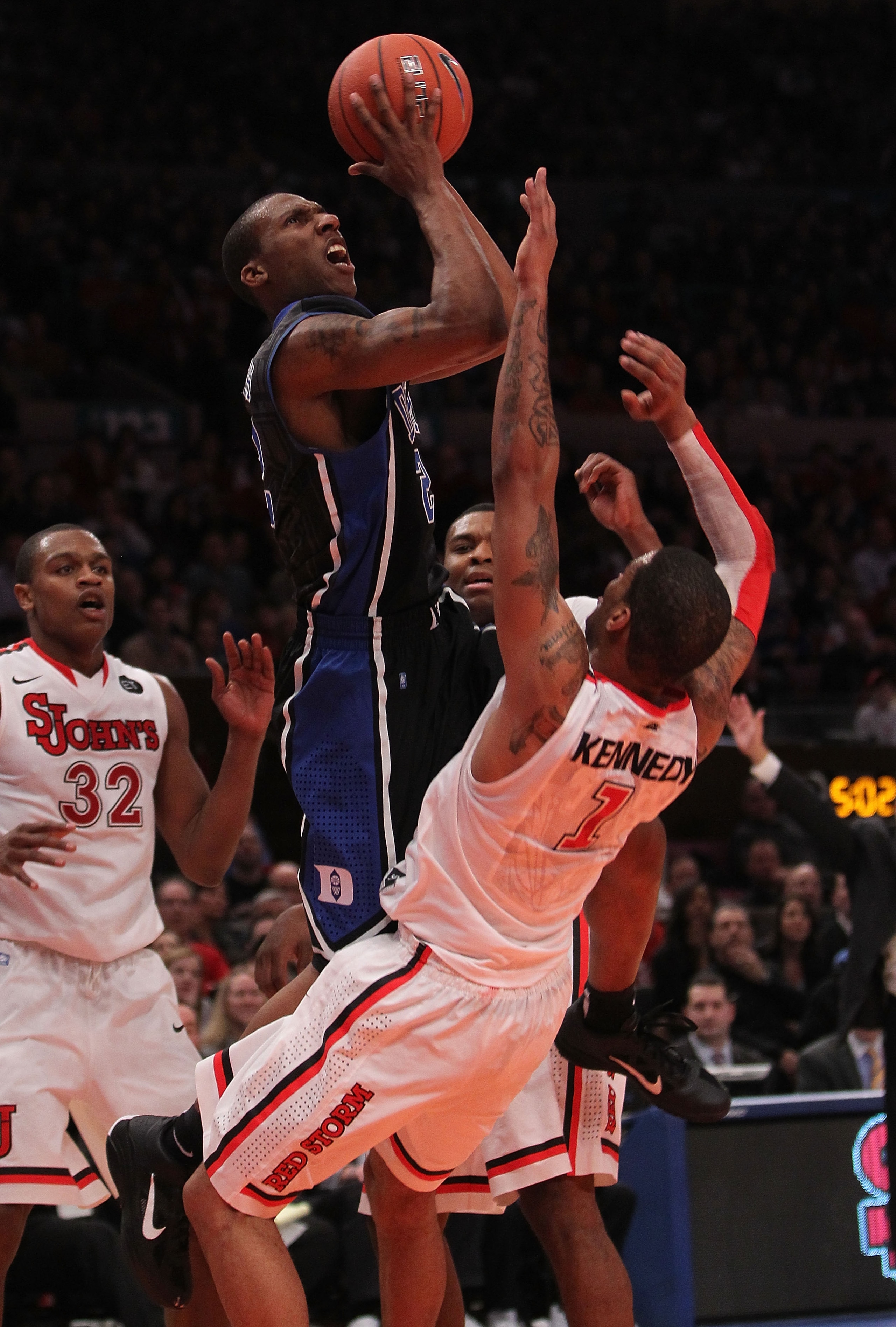 NEW YORK, NY - JANUARY 30:  Nolan Smith #2 of the Duke Blue Devils shoots the ball over D.J. Kennedy #1 of the St. John's Red Storm at Madison Square Garden on January 30, 2011 in New York City.  (Photo by Nick Laham/Getty Images)