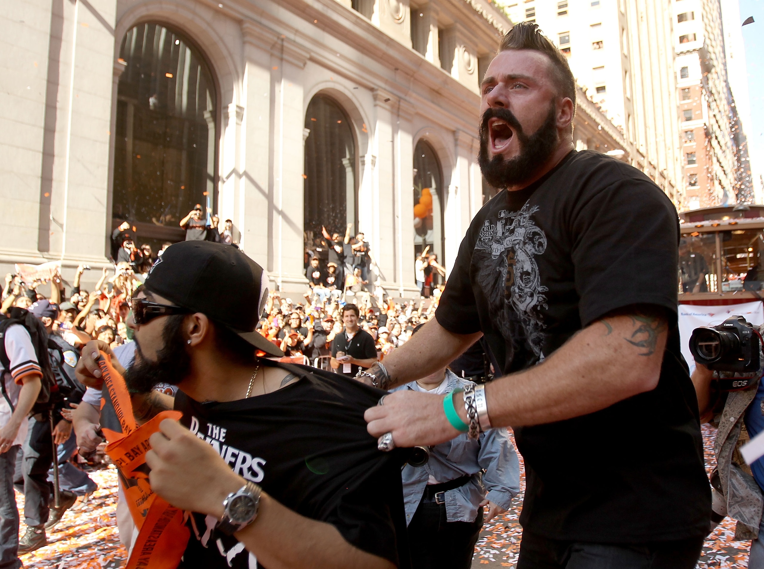 SAN FRANCISCO - NOVEMBER 03:  Pitcher Brian Wilson of the San Francisco Giants jumps on Sergio Romo during the San Francisco Giants victory parade on November 3, 2010 in San Francisco, California.  (Photo by Ezra Shaw/Getty Images)