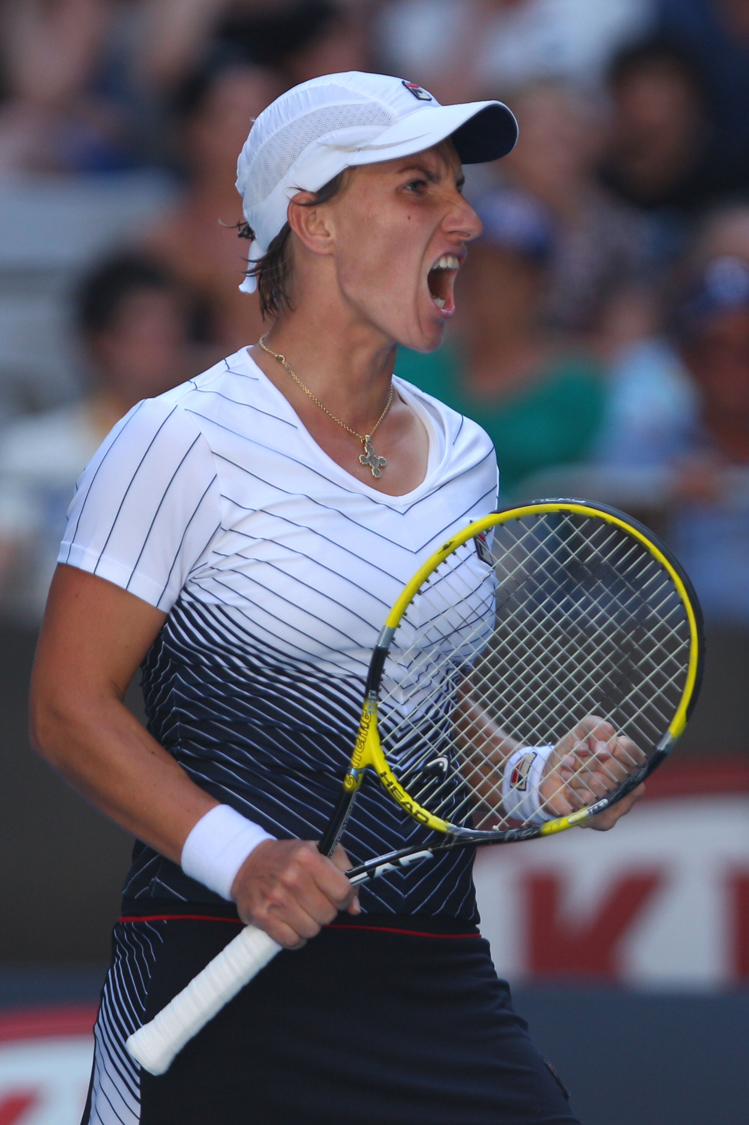 MELBOURNE, AUSTRALIA - JANUARY 23:  Svetlana Kuznetsova of Russia reacts after winning a point in her fourth round match against Francesca Schiavone of Italy during day seven of the 2011 Australian Open at Melbourne Park on January 23, 2011 in Melbourne,