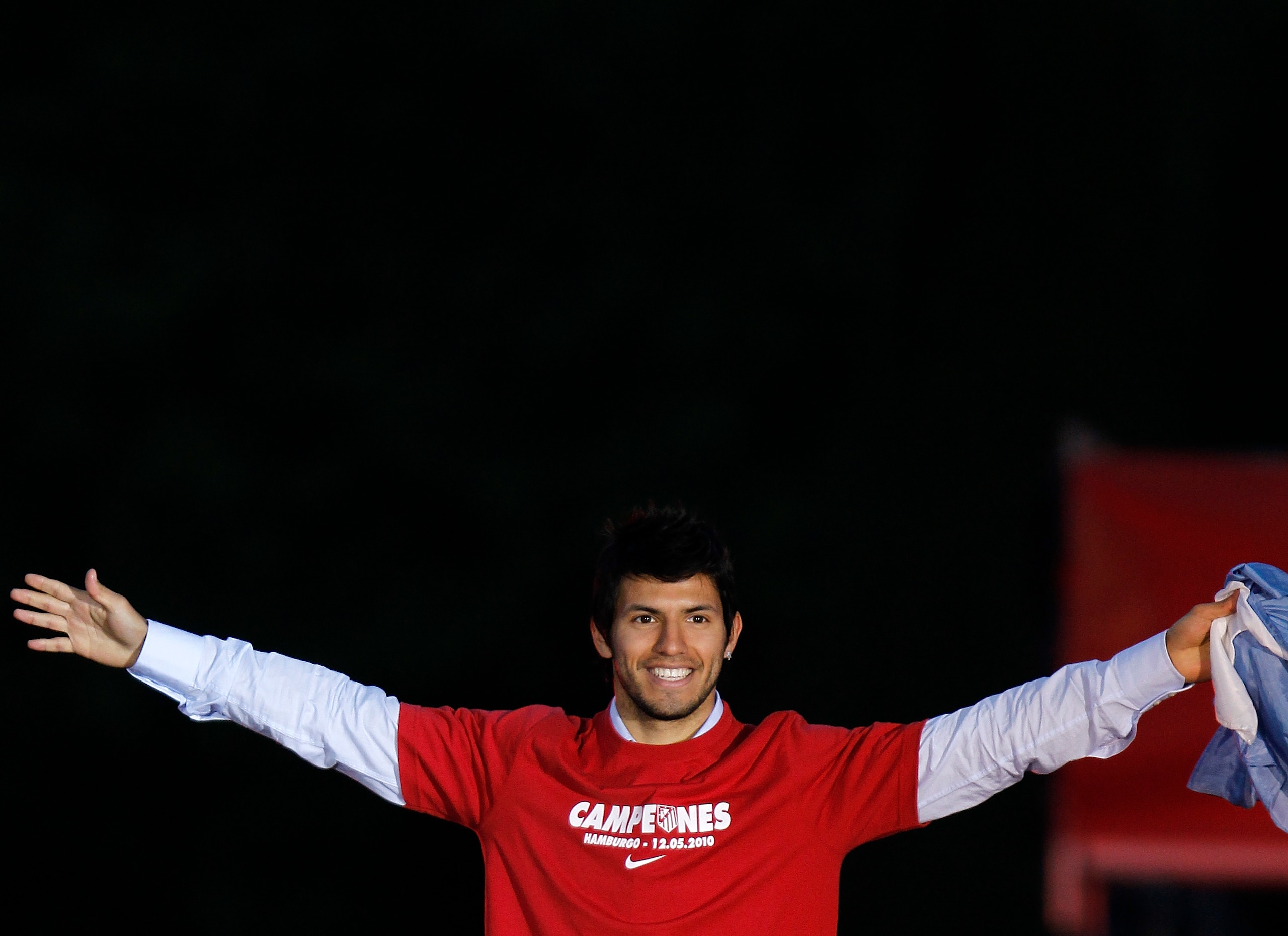 MADRID, SPAIN - MAY 13:  Atletico Madrid player Sergio Aguero celebrates at the Neptuno fountain in Madrid the day after Atletico won the UEFA Europa League Cup final on May 13, 2010 in Madrid, Spain. Atletico beat Fulham in the final in Hamburg.  (Photo