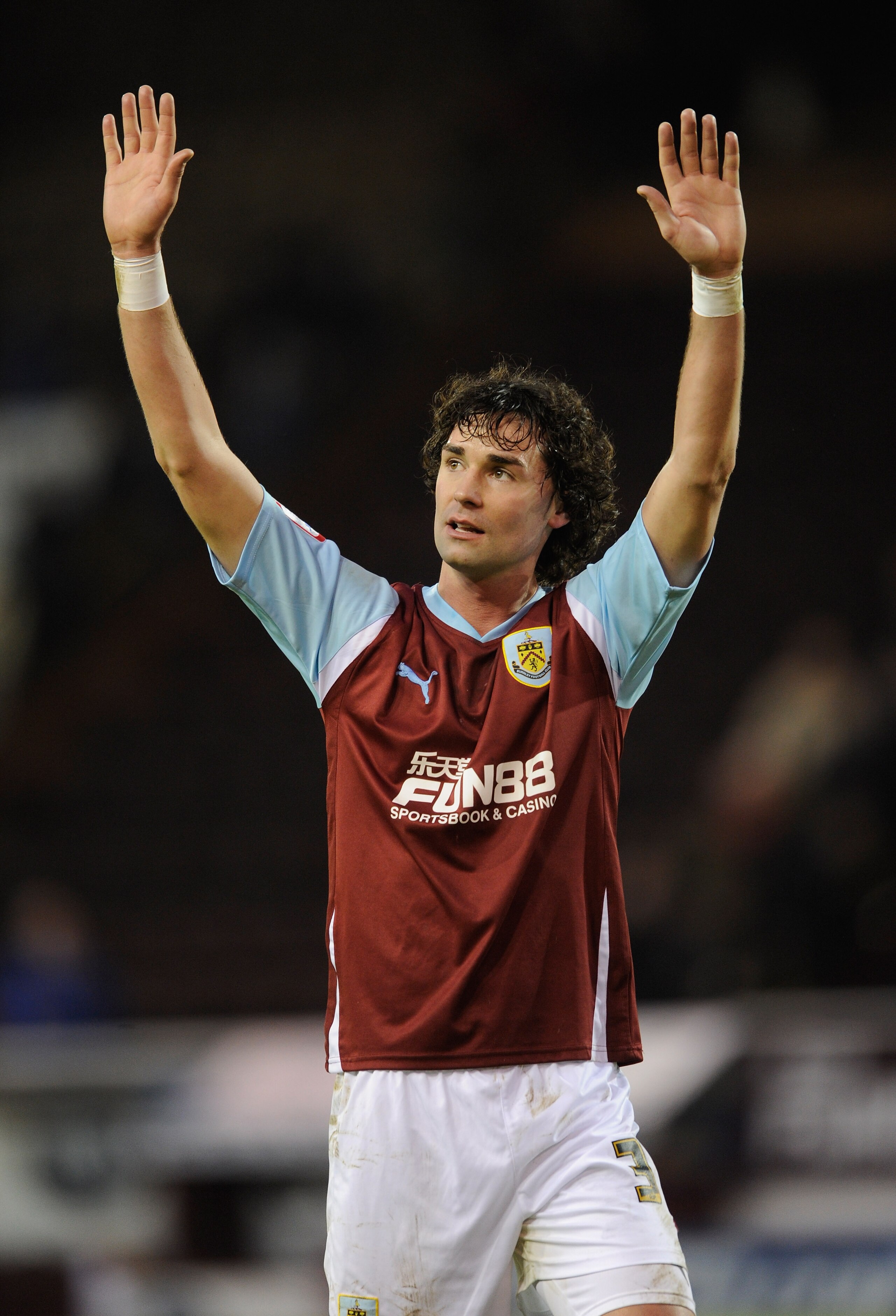 BURNLEY, ENGLAND - JANUARY 29: Chris Eagles of Burnley salutes the fans after the FA Cup sponsored by Eon 4th Round match between Burnley and Burton Albion at Turf Moor on January 29, 2011 in Burnley, England.  (Photo by Michael Regan/Getty Images)