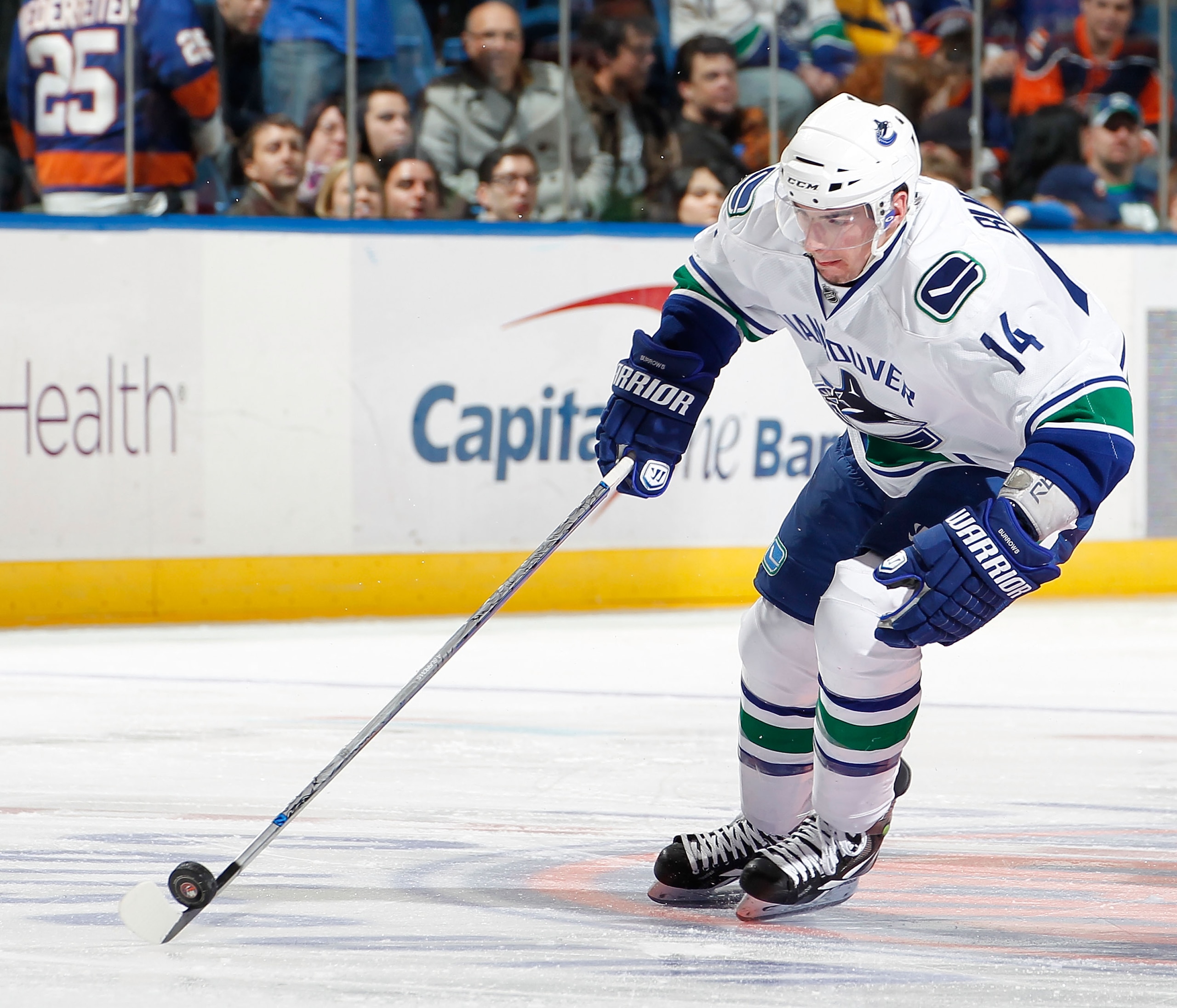 UNIONDALE, NY - JANUARY 11:  Alexandre Burrows #14 of the Vancouver Canucks skates during an NHL game against the New York Islanders at Nassau Coliseum on January 11, 2011 in Uniondale, New York.  (Photo by Paul Bereswill/Getty Images)