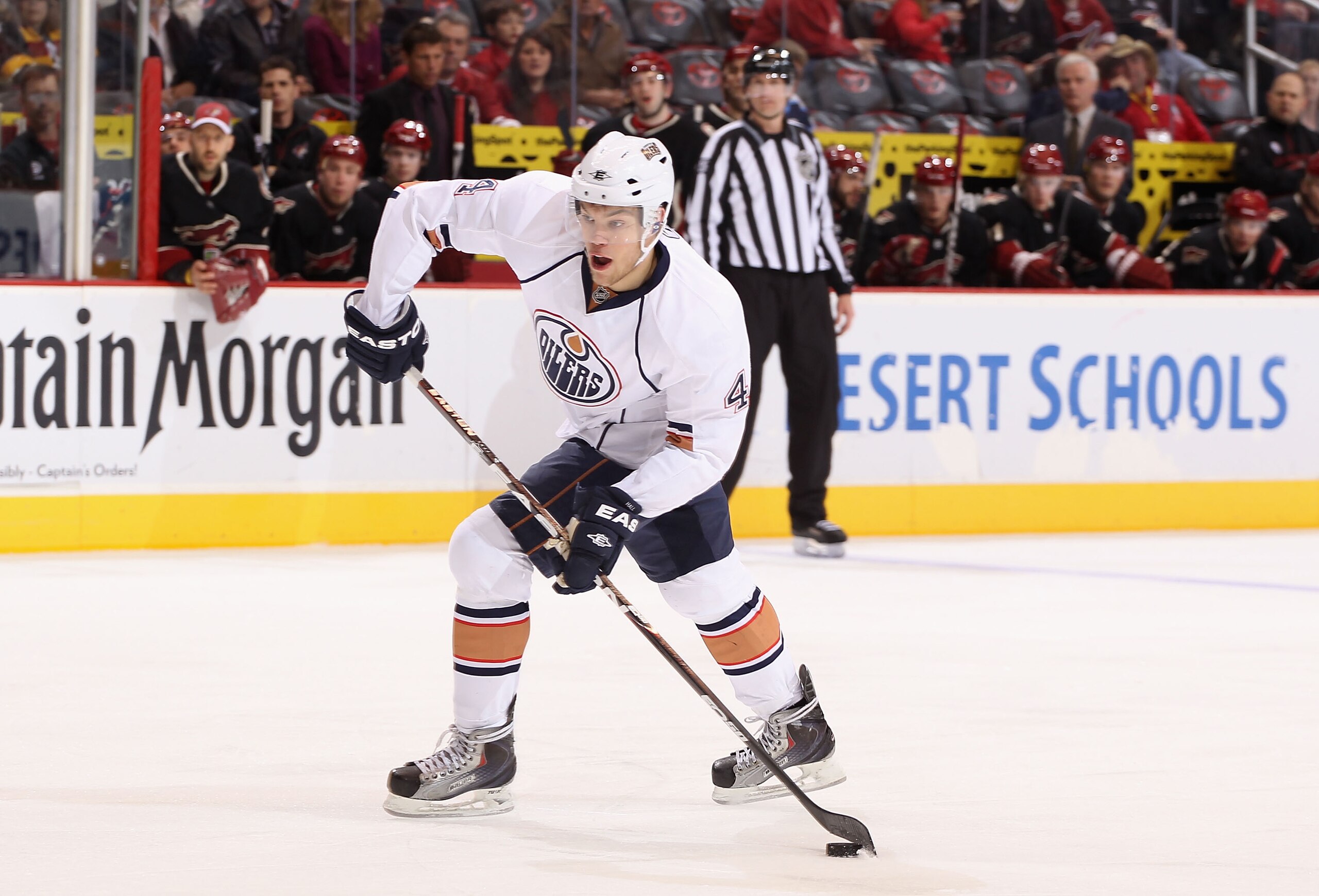 GLENDALE, AZ - JANUARY 25:  Taylor Hall #4 of the Edmonton Oilers skates with the puck during the NHL game against the Phoenix Coyotes at Jobing.com Arena on January 25, 2011 in Glendale, Arizona.  The Oilers defeated the Coyotes 4-3.  (Photo by Christian