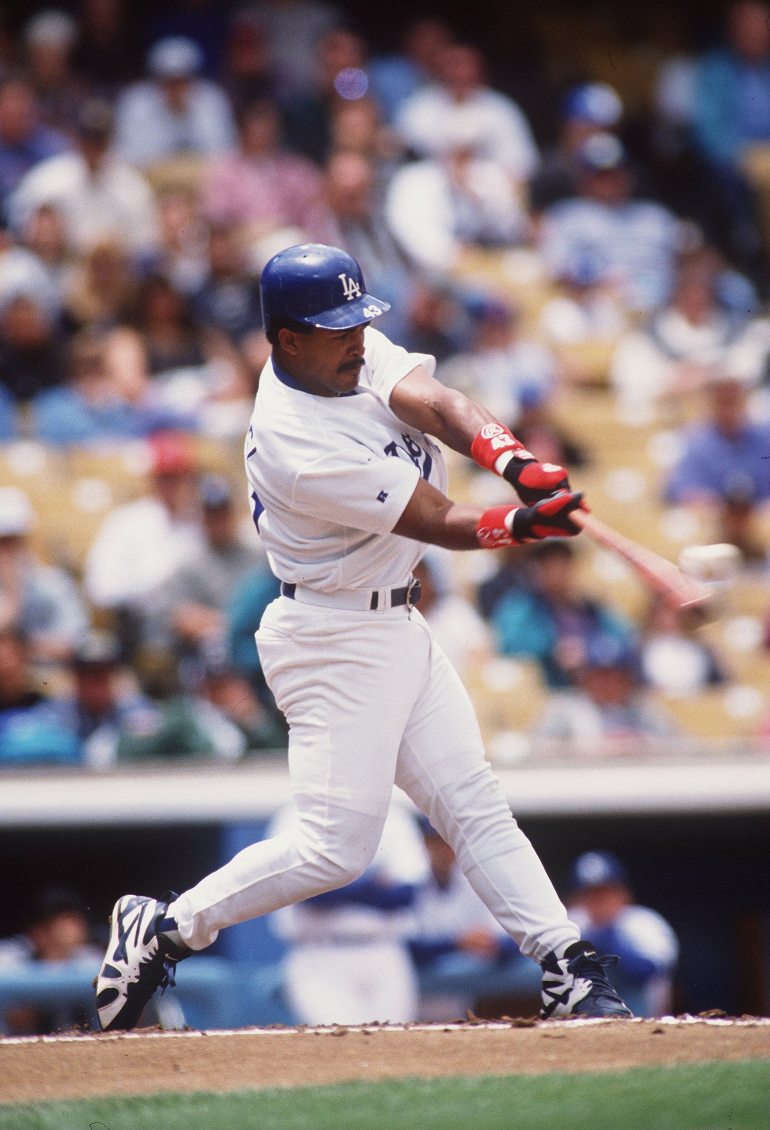 14 MAY 1995: LOS ANGELES DODGERS OUTFIELDER RAUL MONDESI MAKES CONTACT WITH A PITCH DURING THE DODGERS 6-5 LOSS TO THE ST. LOUIS CARDINALS AT DODGER STADIUM IN LOS ANGELES, CALIFORNIA. Mandatory Credit: Stephen Dunn/ALLSPORT 14 MAY 1995: LOS ANGELES DODGERS OUTFIELDER RAUL MONDESI MAKES CONTACT WITH A PITCH DURING THE DODGERS 6-5 LOSS TO THE ST. LOUIS CARDINALS AT DODGER STADIUM IN LOS ANGELES, CALIFORNIA. Mandatory Credit: Stephen Dunn/ALLSPORT