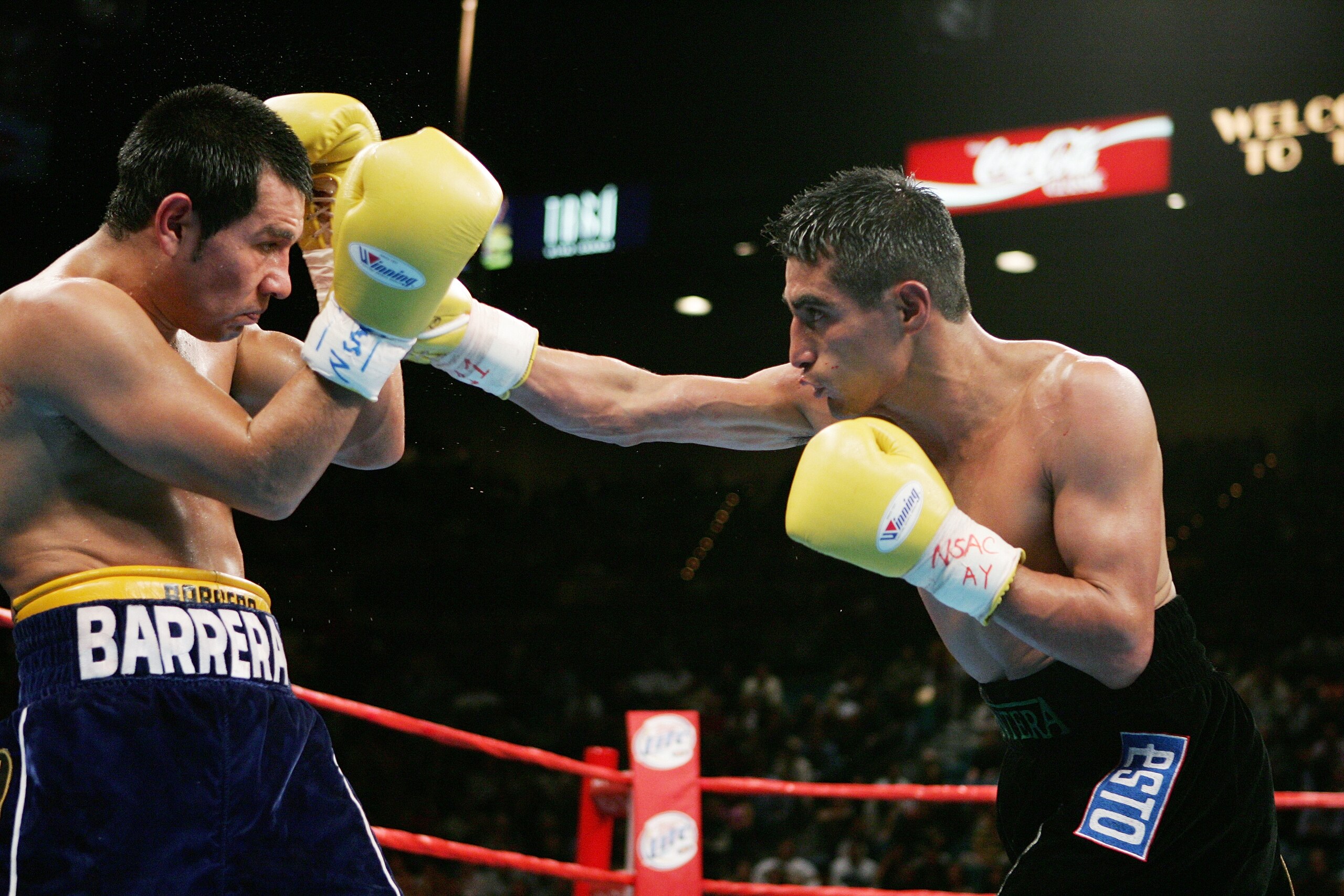 LAS VEGAS - NOVEMBER 27:  Marco Antonio Barrera (l) blocks the right hand of Erik Morales (r) during the WBC World Super Featherweight Championship at the MGM Grand Garden Arena on November 27, 2004 in Las Vegas, Nevada. Barrera defeated Morales in a majo