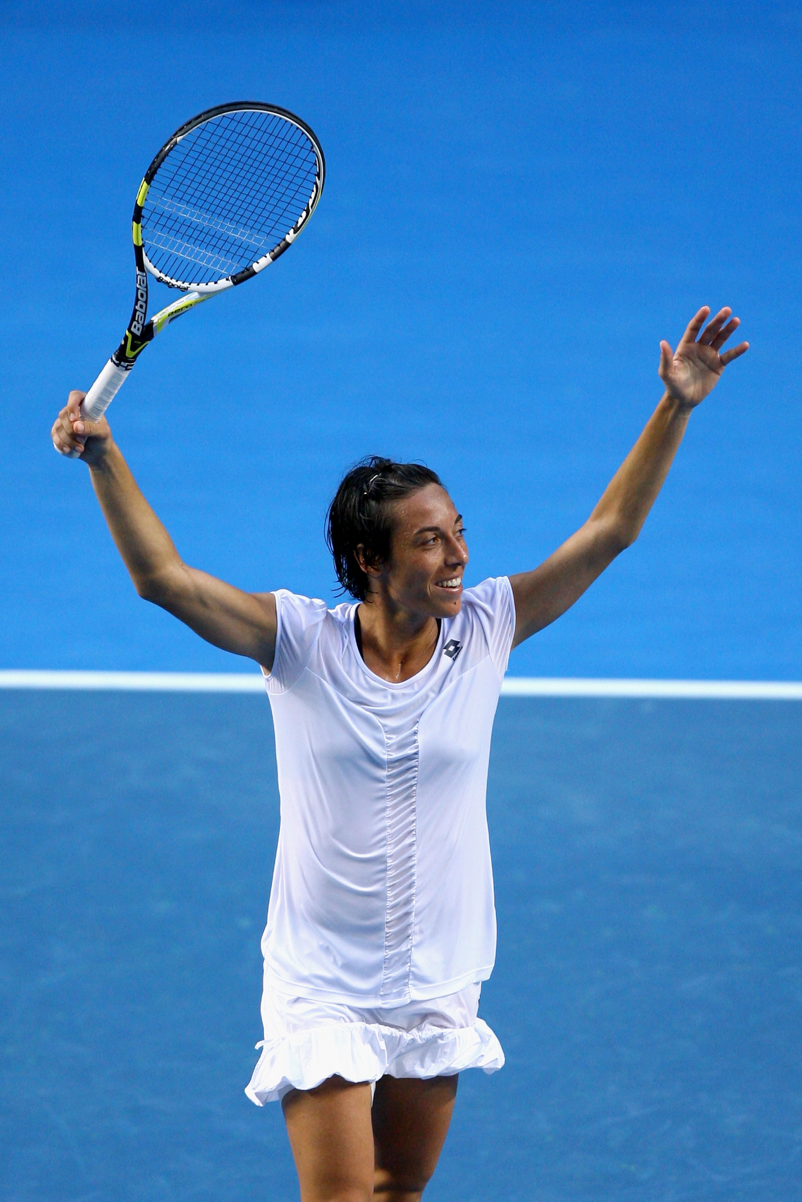 MELBOURNE, AUSTRALIA - JANUARY 23:  Francesca Schiavone of Italy celebrates after winning her fourth round match against Svetlana Kuznetsova of Russia during day seven of the 2011 Australian Open at Melbourne Park on January 23, 2011 in Melbourne, Austral