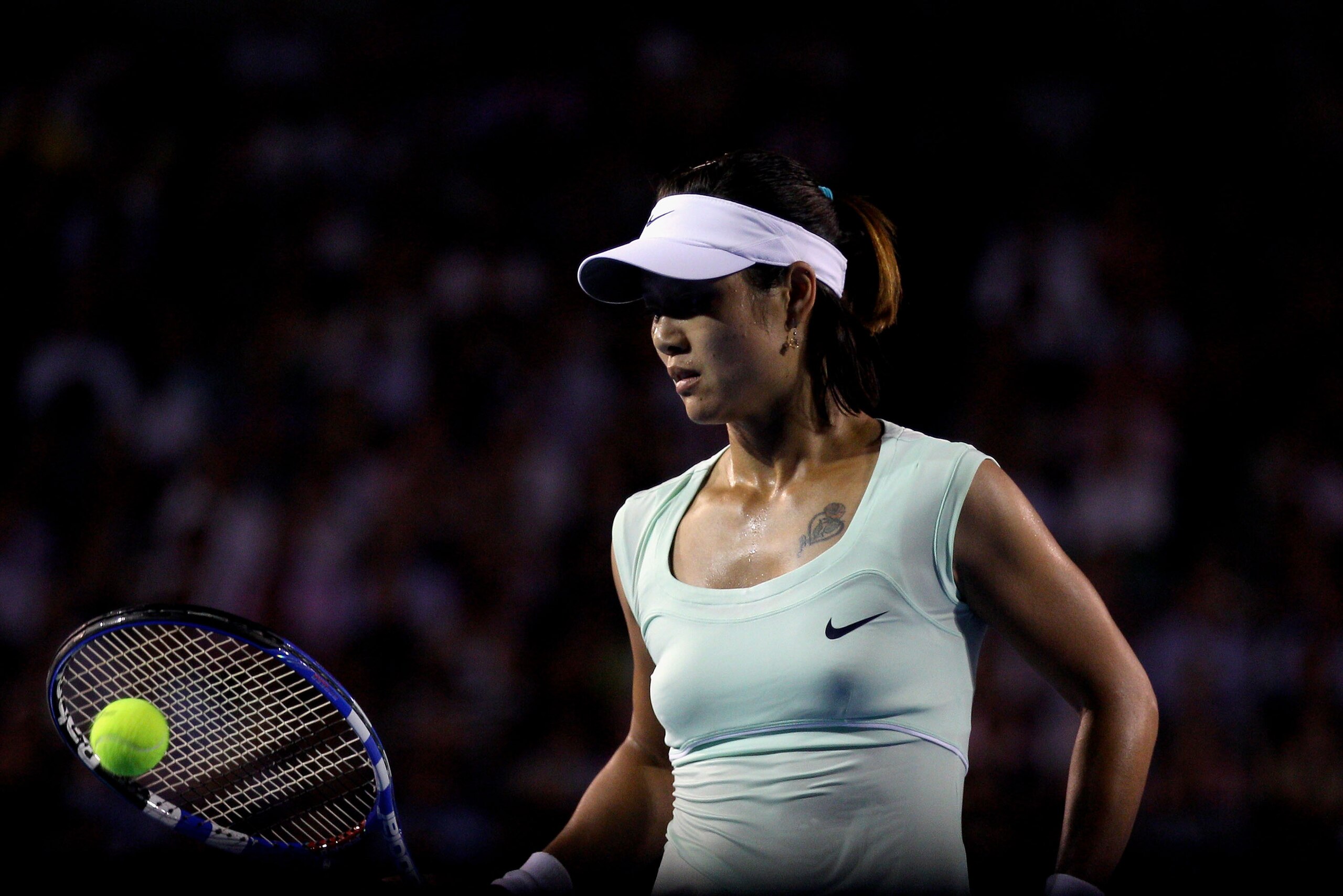 MELBOURNE, AUSTRALIA - JANUARY 29:  Na Li of China shows emotion during her women's final match against Kim Clijsters of Belgium during day thirteen of the 2011 Australian Open at Melbourne Park on January 29, 2011 in Melbourne, Australia.  (Photo by Mark
