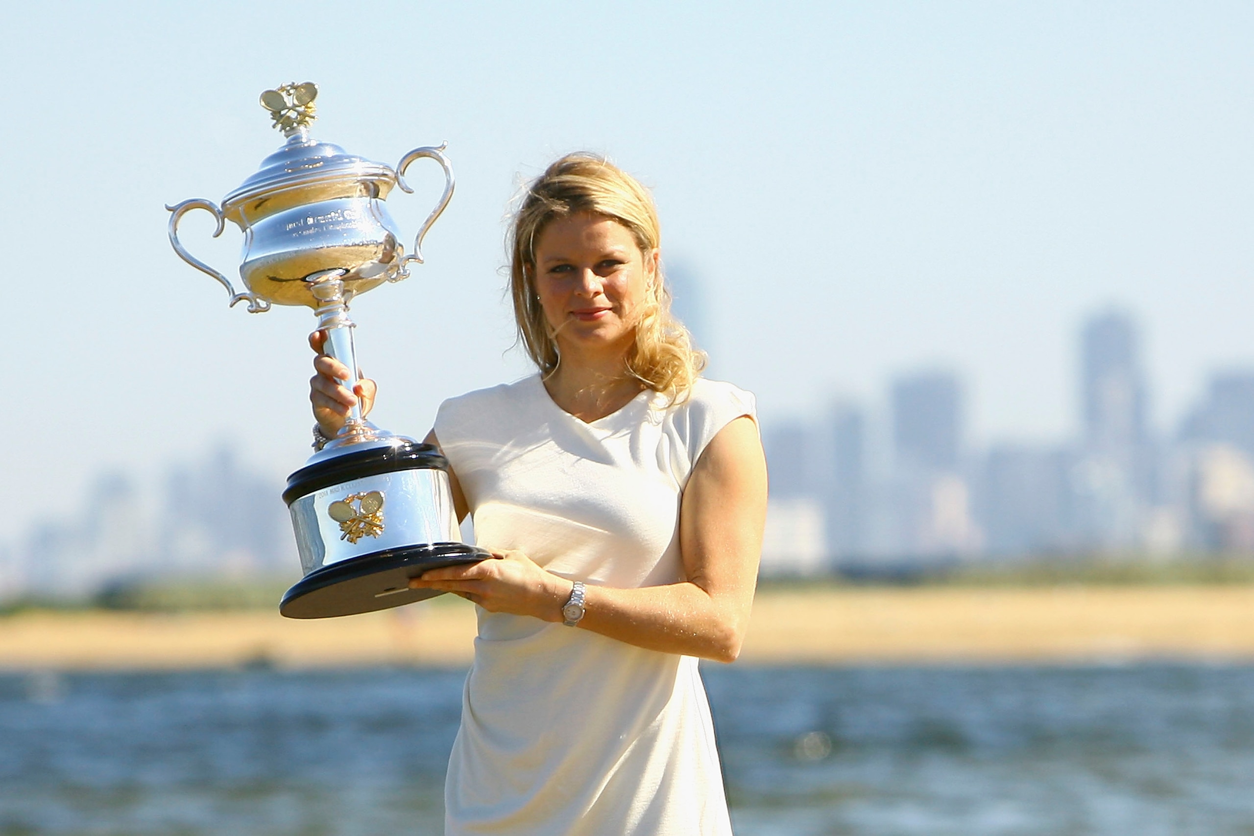 MELBOURNE, AUSTRALIA - JANUARY 30:  Kim Clijsters of Belgium poses with the Daphne Akhurst Trophy after winning the 2011 Women's Australian Open final, at Brighton Beach on January 30, 2011 in Melbourne, Australia.  (Photo by Robert Prezioso/Getty Images)