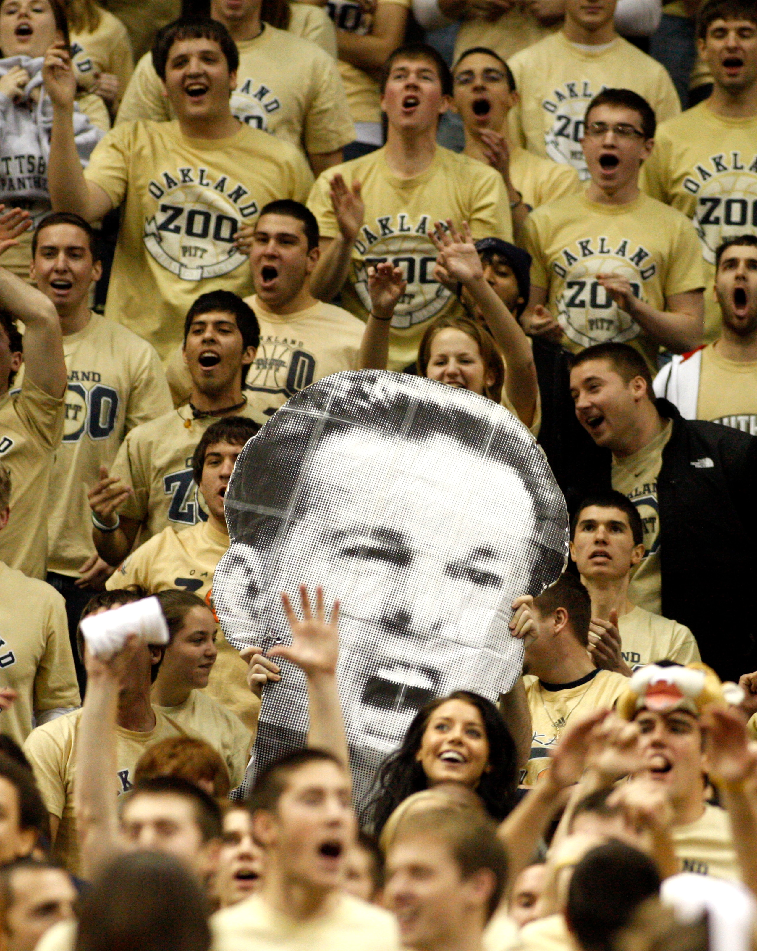 PITTSBURGH, PA - DECEMBER 11:  Pittsburgh Panthers fans hold up a picture of Jamie Dixon's head against the Tennessee Volunteers during the SEC/BIG EAST Invitational at Consol Energy Center on December 11, 2010 in Pittsburgh, Pennsylvania.The Volunteers d