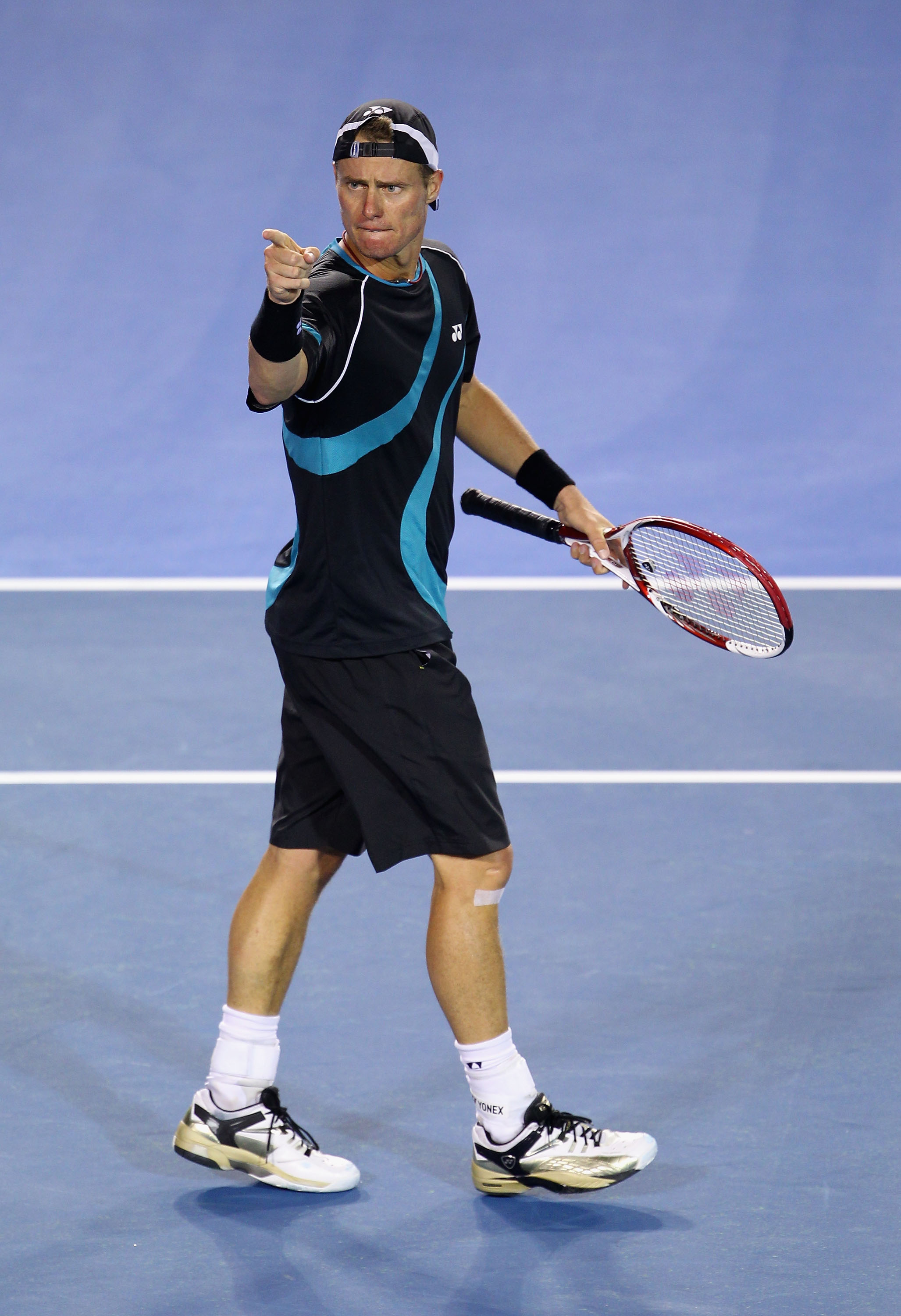 MELBOURNE, AUSTRALIA - JANUARY 18:  Lleyton Hewitt of Australia gestures his first round match against David Nalbandian of Argentina during day two of the 2011 Australian Open at Melbourne Park on January 18, 2011 in Melbourne, Australia.  (Photo by Julia