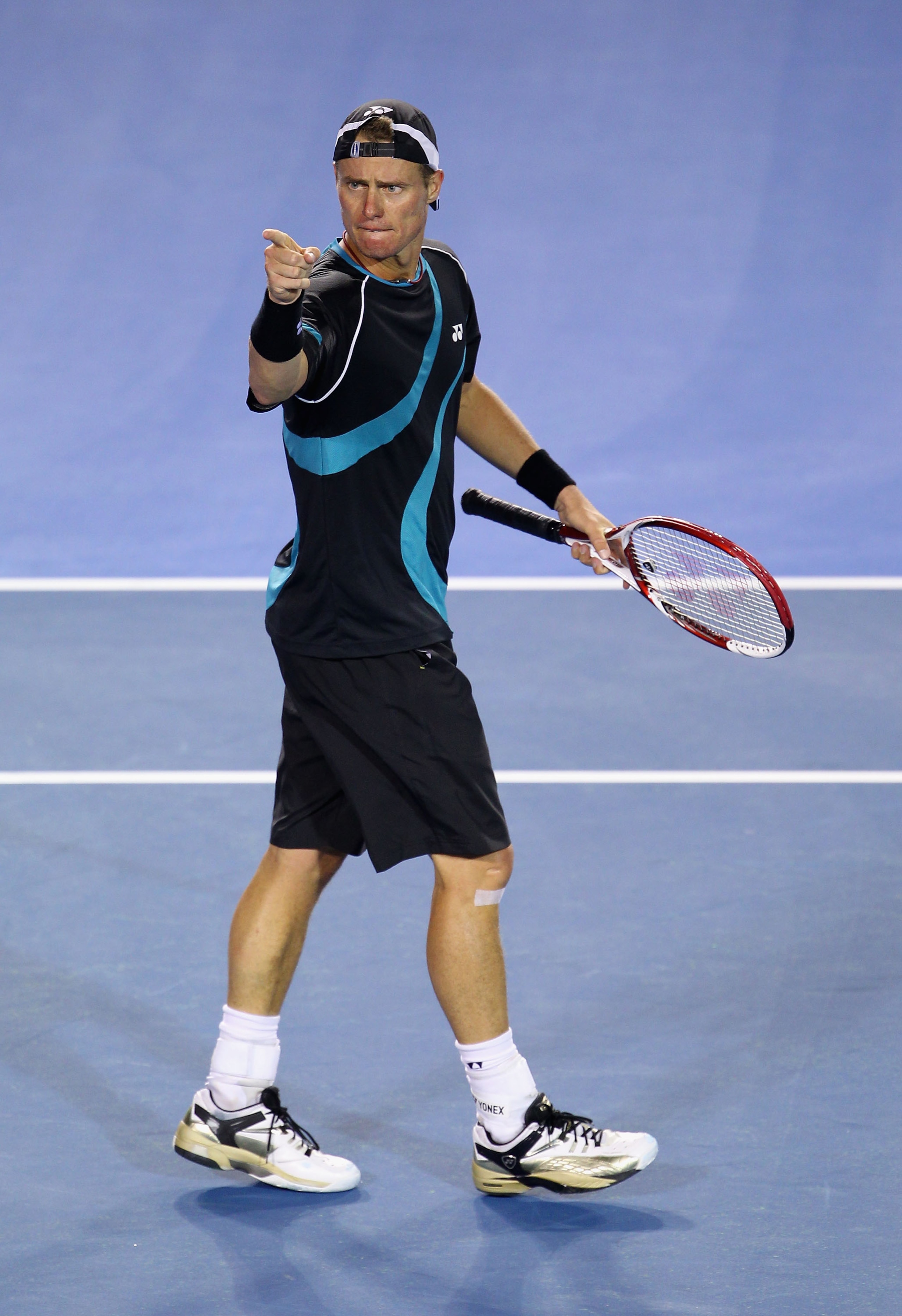 MELBOURNE, AUSTRALIA - JANUARY 18:  Lleyton Hewitt of Australia gestures his first round match against David Nalbandian of Argentina during day two of the 2011 Australian Open at Melbourne Park on January 18, 2011 in Melbourne, Australia.  (Photo by Julia