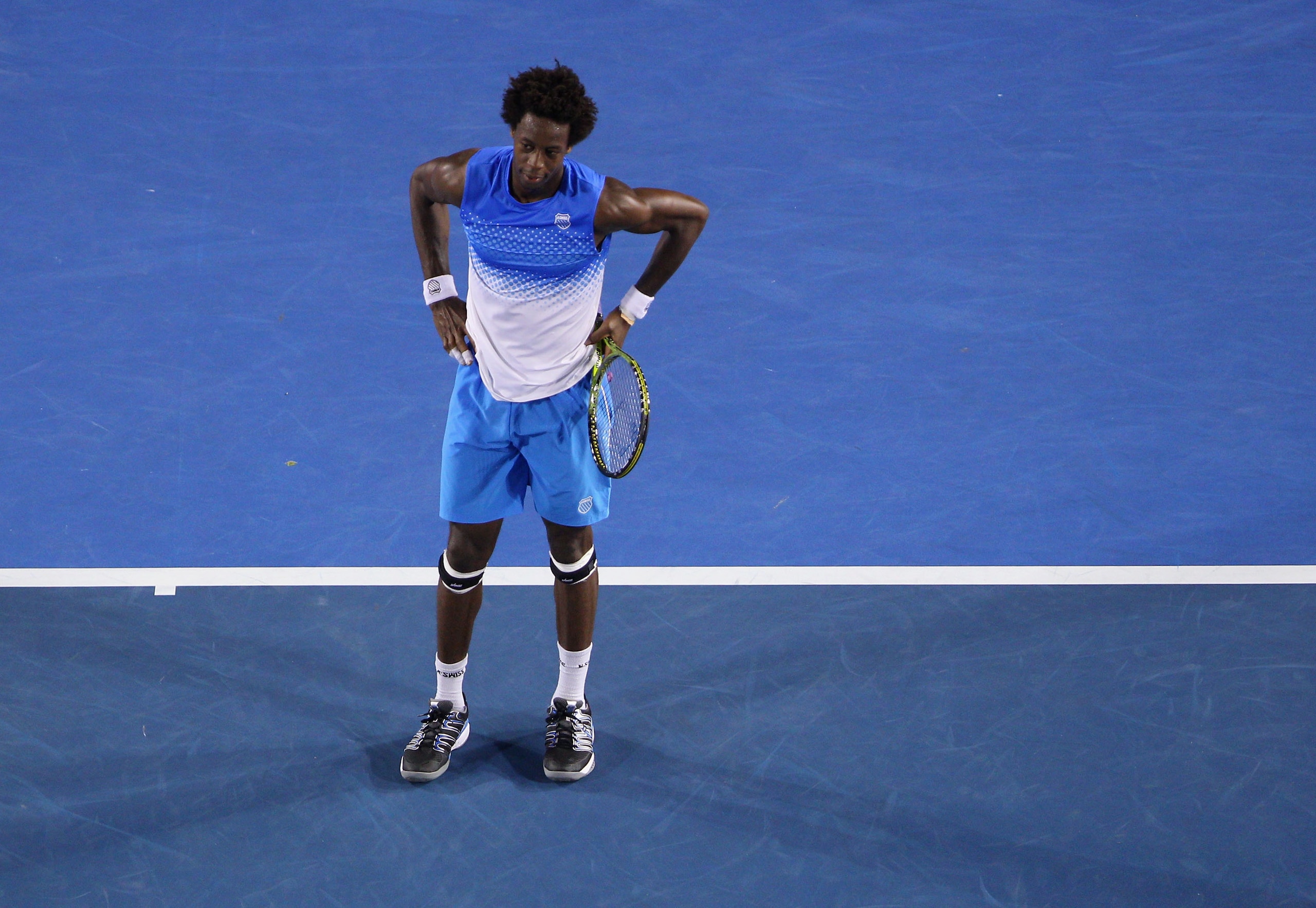MELBOURNE, AUSTRALIA - JANUARY 21:  Gael Monfils of France reacts after match point in his third round match against Stanislas Wawrinka of Switzerland during day five of the 2011 Australian Open at Melbourne Park on January 21, 2011 in Melbourne, Australi