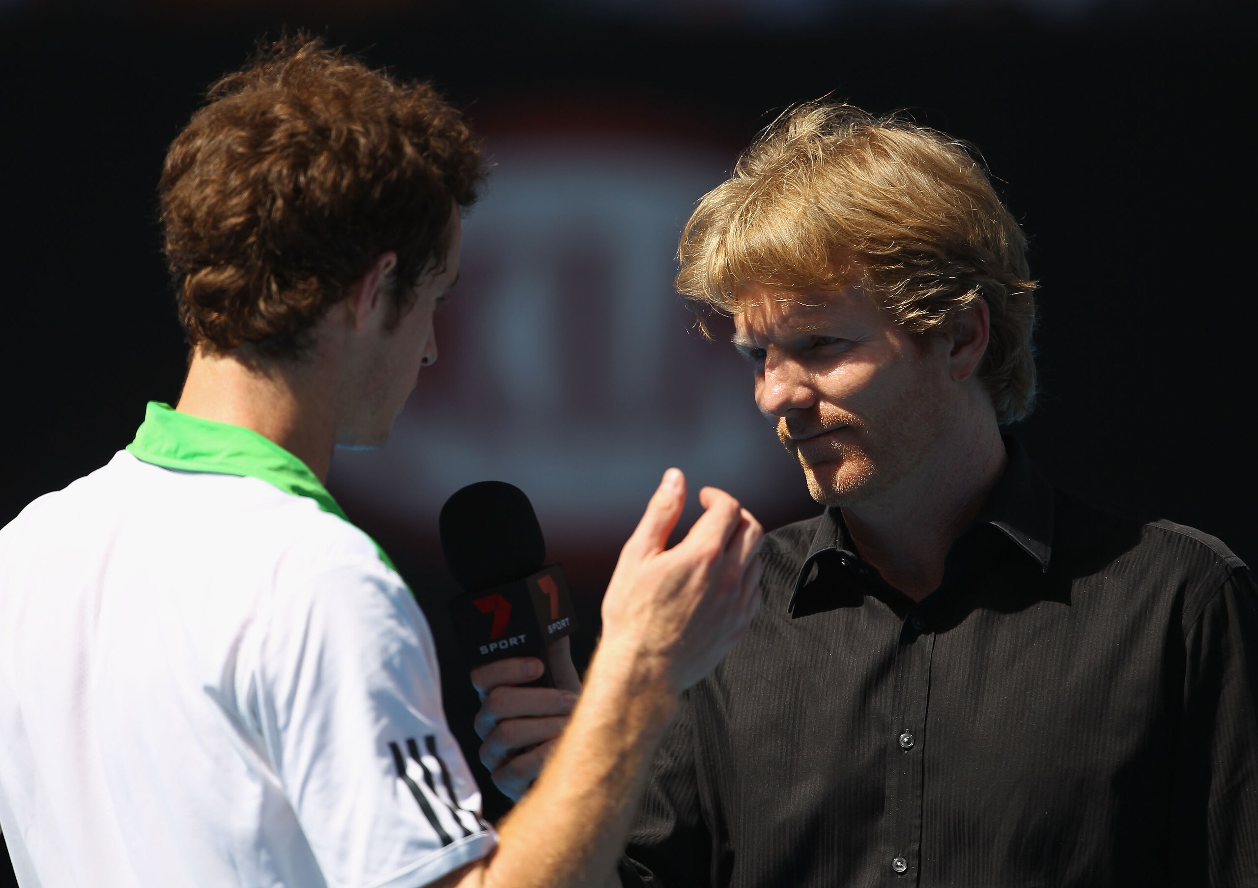 MELBOURNE, AUSTRALIA - JANUARY 24:  Andy Murray of Great Britain is interviewed by Jim Courier after winning his fourth round match against Jurgen Melzer of Austria during day eight of the 2011 Australian Open at Melbourne Park on January 24, 2011 in Melb