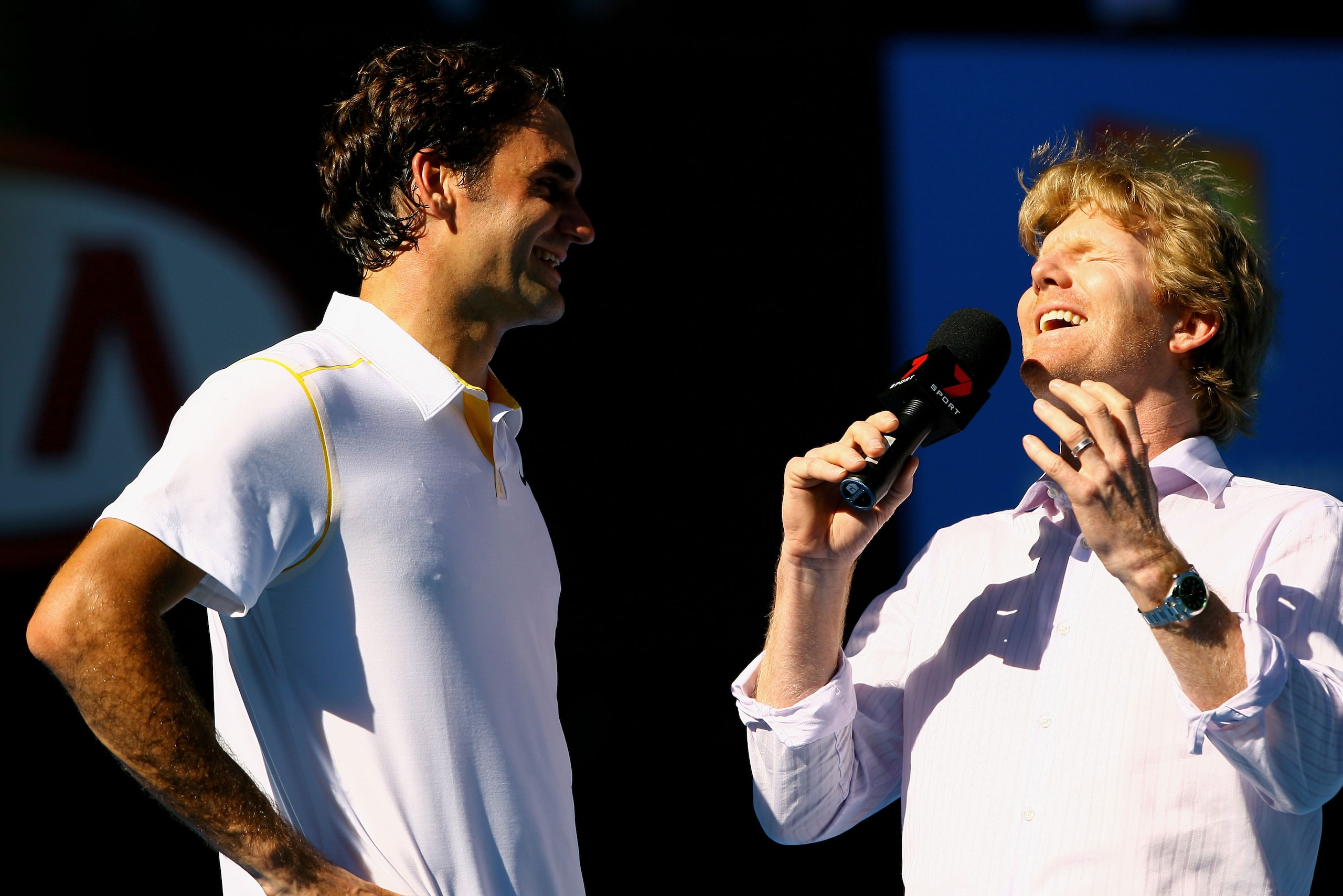 MELBOURNE, AUSTRALIA - JANUARY 23:  Roger Federer of Switzerland is interviewed by Jim Courier after winning his fourth round match against Tommy Robredo of Spain during day seven of the 2011 Australian Open at Melbourne Park on January 23, 2011 in Melbou