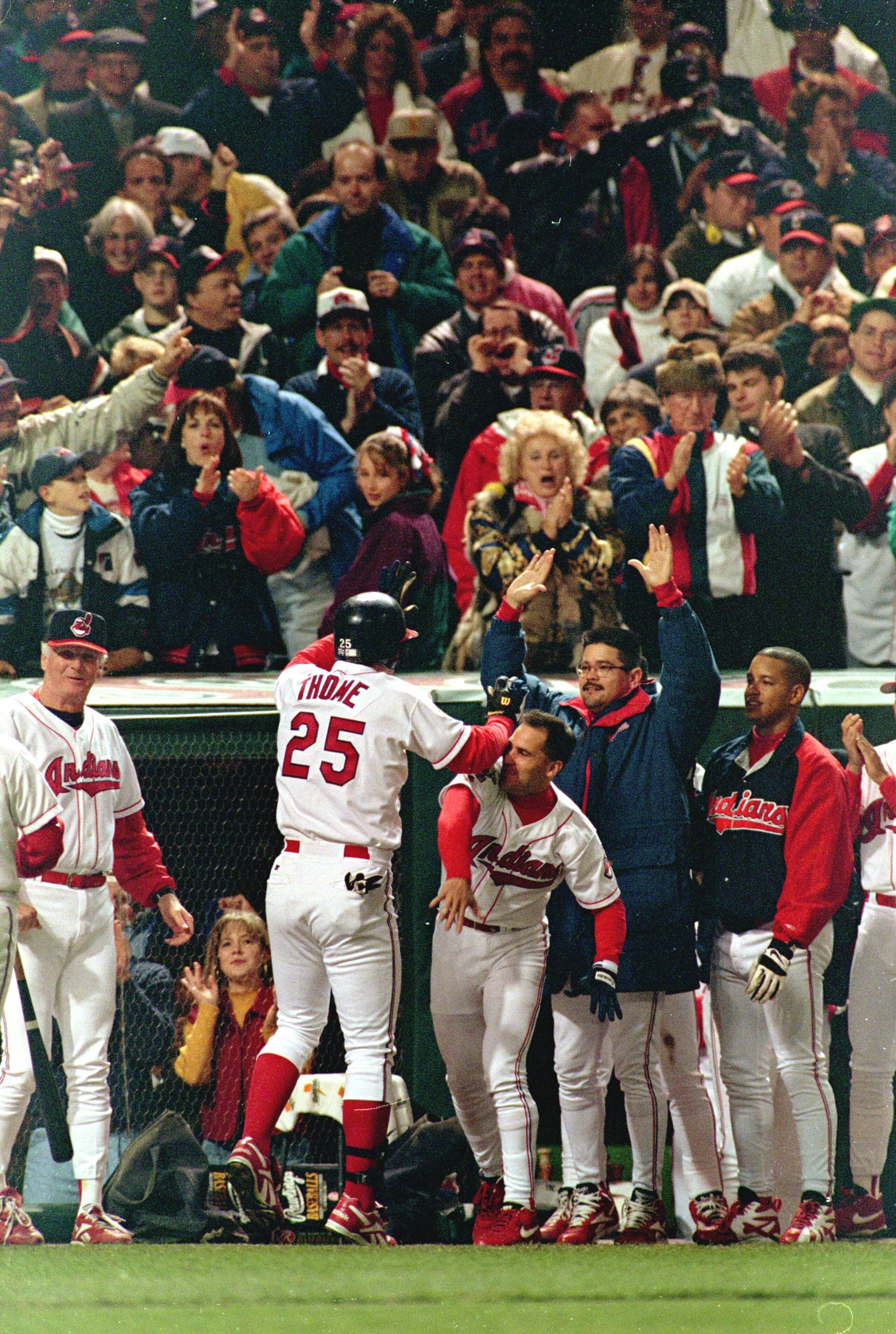 26 Oct 1995:  Jim Thome #25 of the Cleveland Indians celebrates with teammates after a solo home run in the 8th inning during game five of the World Series against the Atlanta Braves at Jacob's Field in Cleveland, Ohio. The Indians defeated the Braves 5-4
