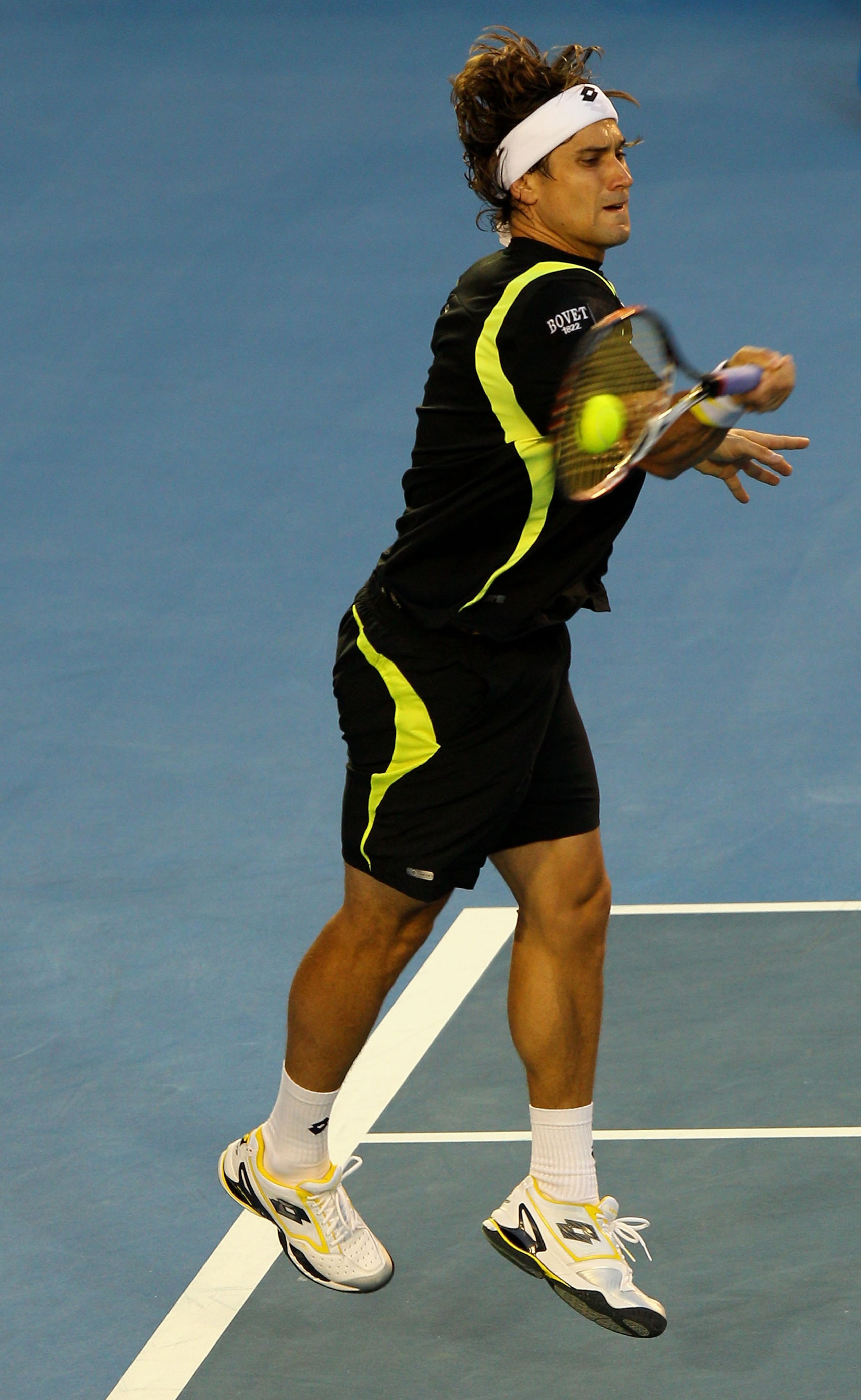 MELBOURNE, AUSTRALIA - JANUARY 28:  David Ferrer of Spain plays a forehand in his semifinal match against Andy Murray of Great Britain during day twelve of the 2011 Australian Open at Melbourne Park on January 28, 2011 in Melbourne, Australia.  (Photo by