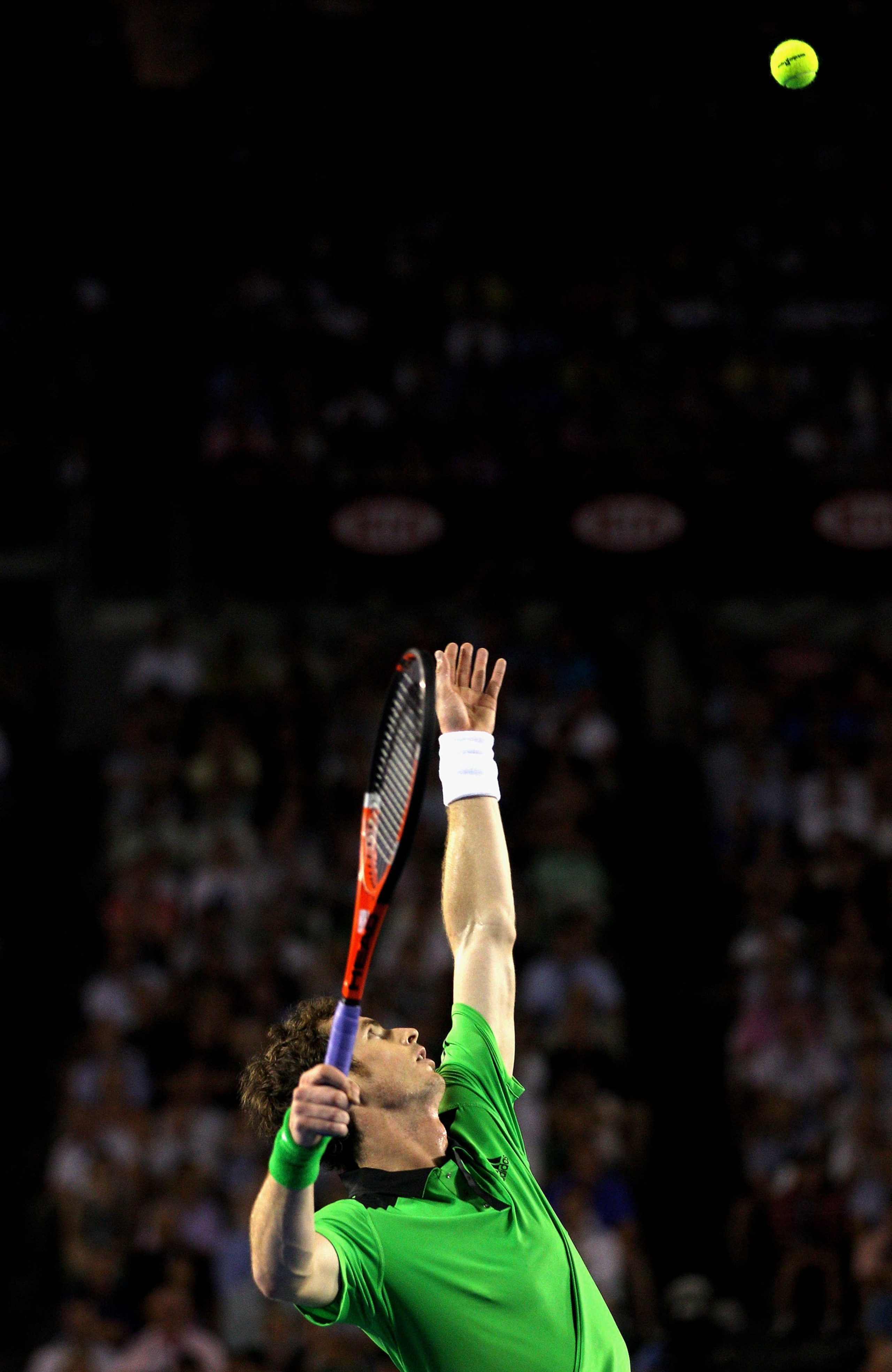MELBOURNE, AUSTRALIA - JANUARY 30:  Andy Murray of Great Britain serves in the men's final match against Novak Djokovic of Serbia during day fourteen of the 2011 Australian Open at Melbourne Park on January 30, 2011 in Melbourne, Australia.  (Photo by Qui
