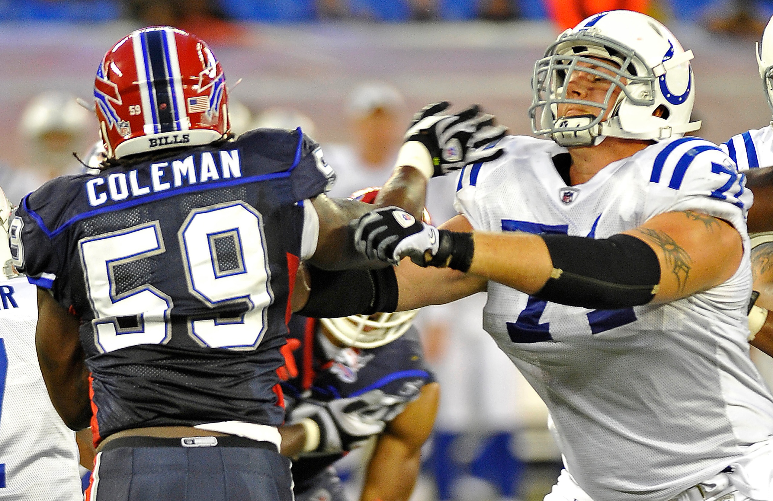 TORONTO, CANADA - AUGUST 19: Antonio Coleman #59 of the Buffalo Bills battles with Ryan Diem #71 of the Indianapolis Colts during game action August 19, 2010 at the Rogers Centre in Toronto, Ontario, Canada. (Photo by Brad White/Getty Images)