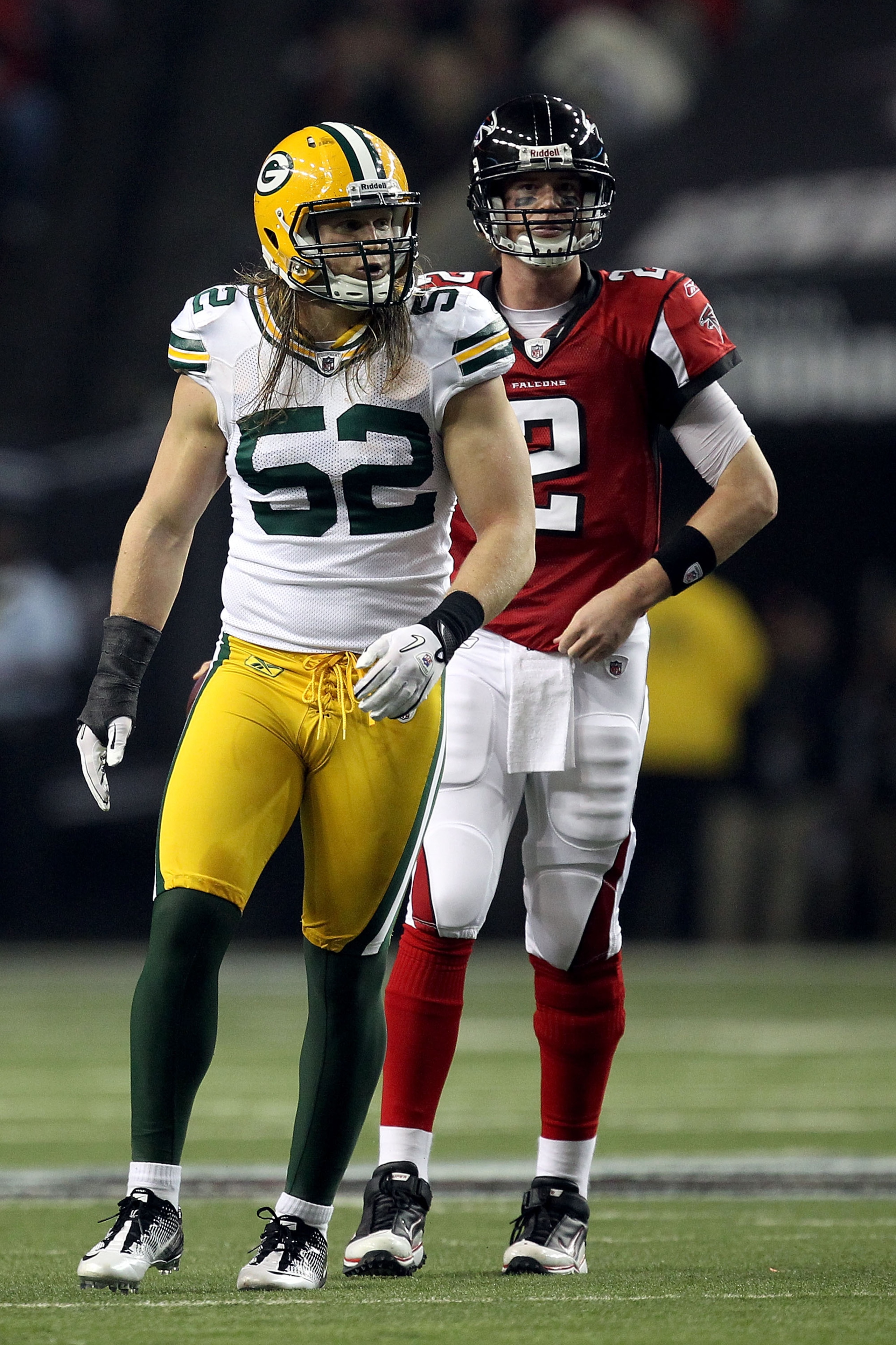 ATLANTA, GA - JANUARY 15:  Linebacker Clay Matthews #52 of the Green Bay Packers and Quarterback Matt Ryan #2 of the Atlanta Falcons look on during their 2011 NFC divisional playoff game at Georgia Dome on January 15, 2011 in Atlanta, Georgia. The Packers