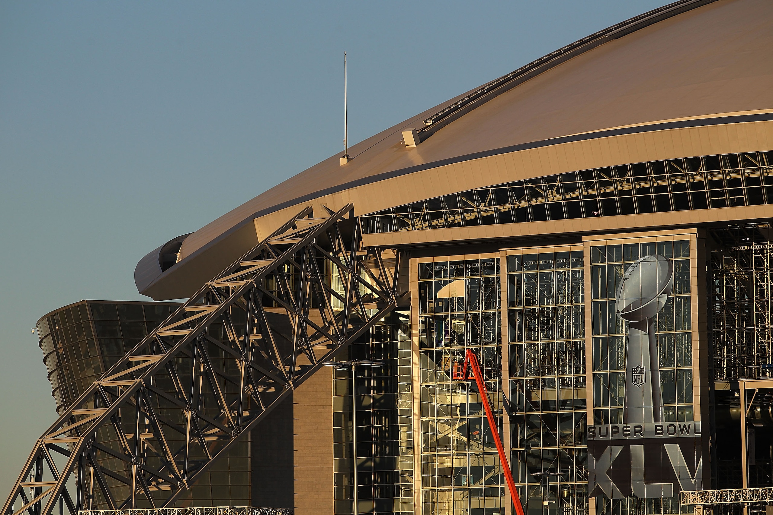 ARLINGTON, TX - JANUARY 27: The logo for Super Bowl XLV outside of Cowboys Stadium on January27, 2011 in Arlington, Texas. Cowboys Stadium will host Super Bowl XLV on February 6, 2011 between the Pittsburgh Steelers and the Green Bay Packers in Dallas, ARLINGTON, TX - JANUARY 27: The logo for Super Bowl XLV outside of Cowboys Stadium on January27, 2011 in Arlington, Texas. Cowboys Stadium will host Super Bowl XLV on February 6, 2011 between the Pittsburgh Steelers and the Green Bay Packers in Dallas,