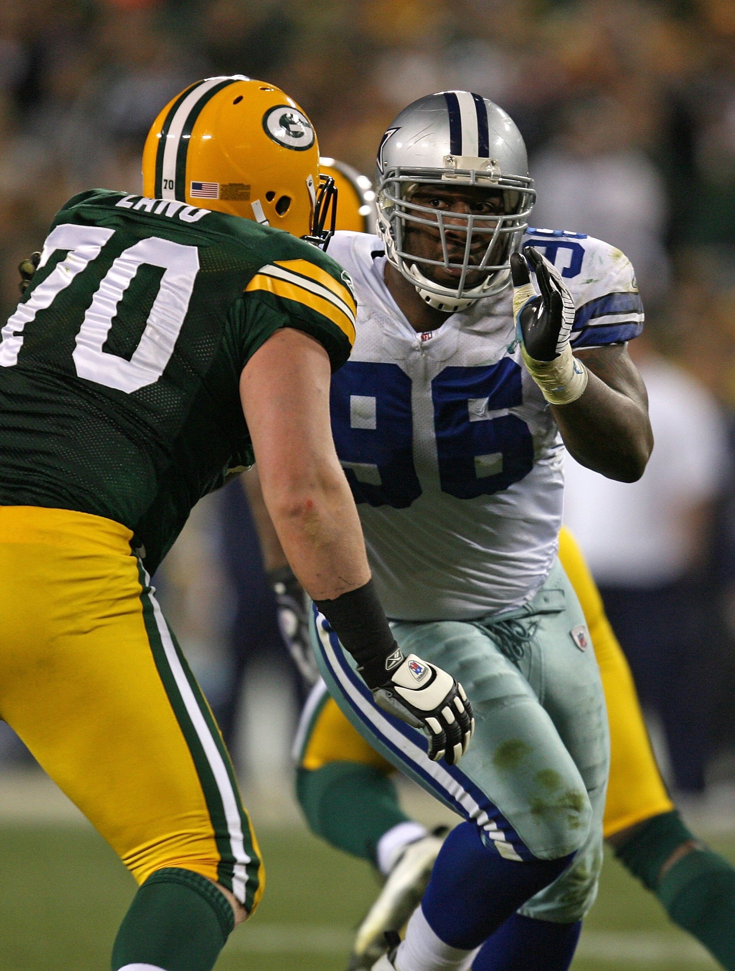 GREEN BAY, WI - NOVEMBER 15: Marcus Spears #96 of the Dallas Cowboys rushes against T.J. Lang #70 of the Green Bay Packers at Lambeau Field on November 15, 2009 in Green Bay, Wisconsin. The Packers defeated the Cowboys 17-7. (Photo by Jonathan Daniel/Gett