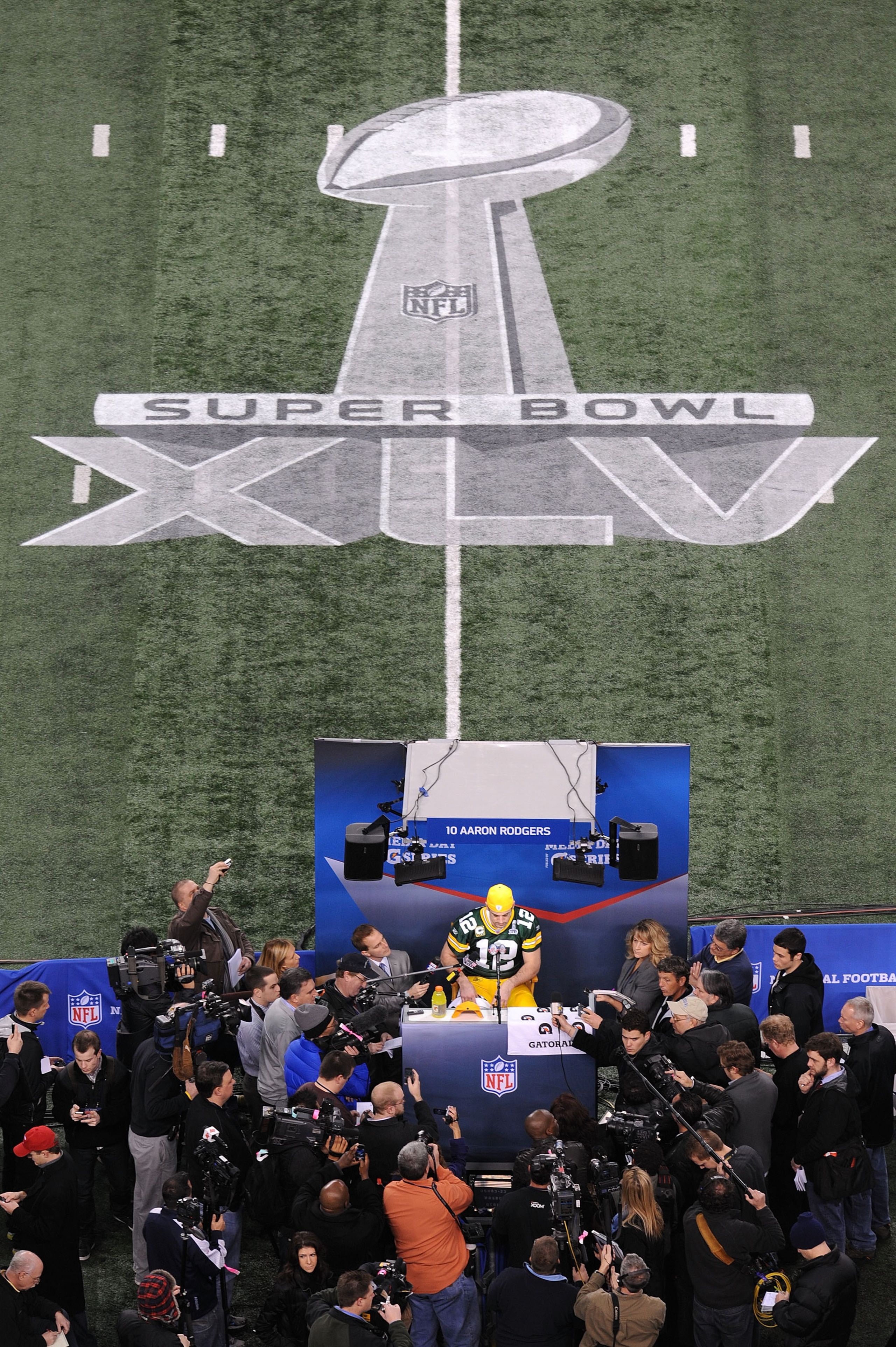 ARLINGTON, TX - FEBRUARY 01: Quarterback Aaron Rodgers #12 of the Green Bay Packers speaks during Super Bowl XLV Media Day ahead of Super Bowl XLV at Cowboys Stadium on February 1, 2011 in Arlington, Texas. The Pittsburgh Steelers will play the Green Bay ARLINGTON, TX - FEBRUARY 01: Quarterback Aaron Rodgers #12 of the Green Bay Packers speaks during Super Bowl XLV Media Day ahead of Super Bowl XLV at Cowboys Stadium on February 1, 2011 in Arlington, Texas. The Pittsburgh Steelers will play the Green Bay