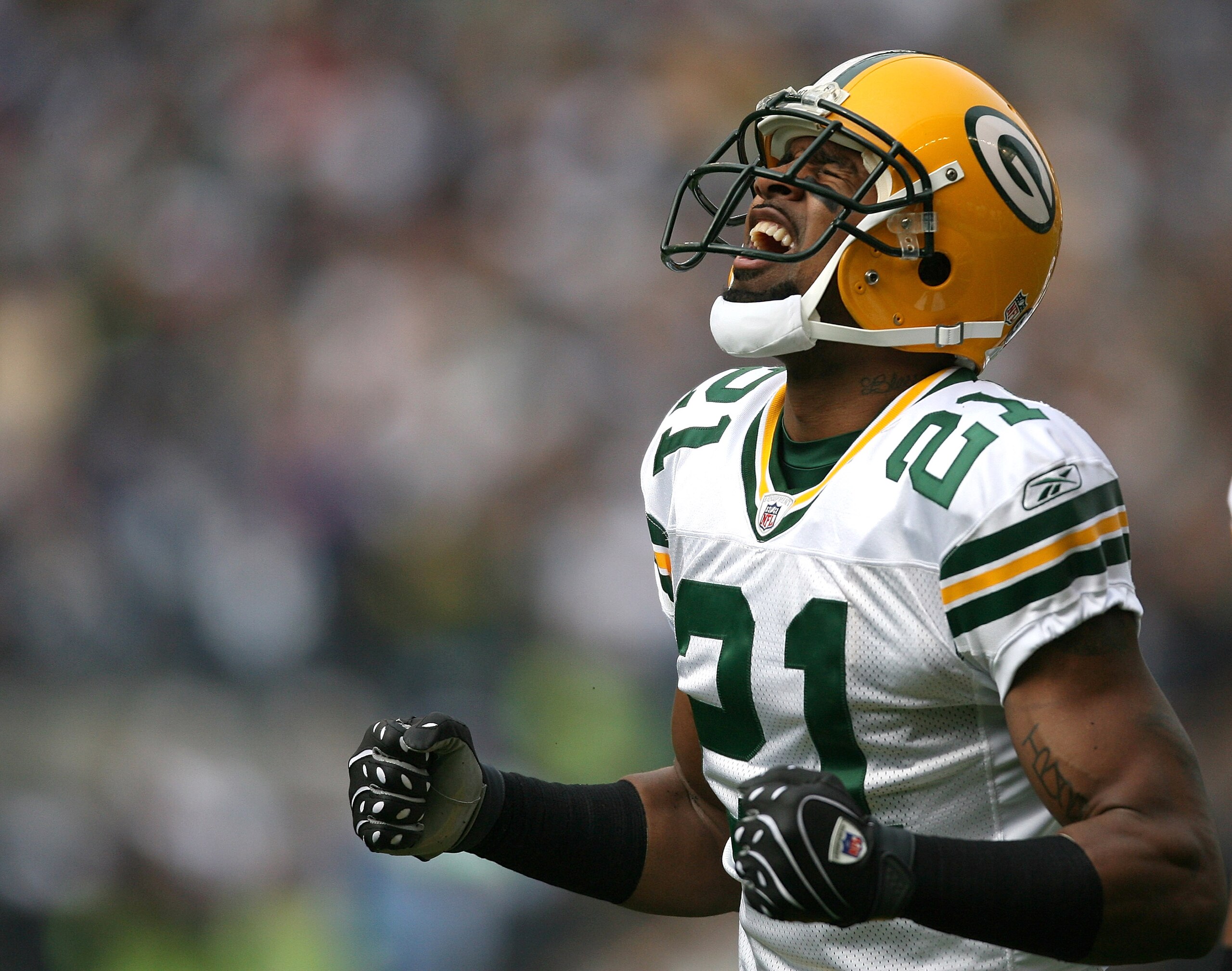 SEATTLE - OCTOBER 12:  Cornerback Charles Woodson #21 of the Green Bay Packers reacts after just missing an interception in the first half against the Seattle Seahawks on October 12, 2008 at Qwest Field in Seattle, Washington. The Packers defeated the Sea