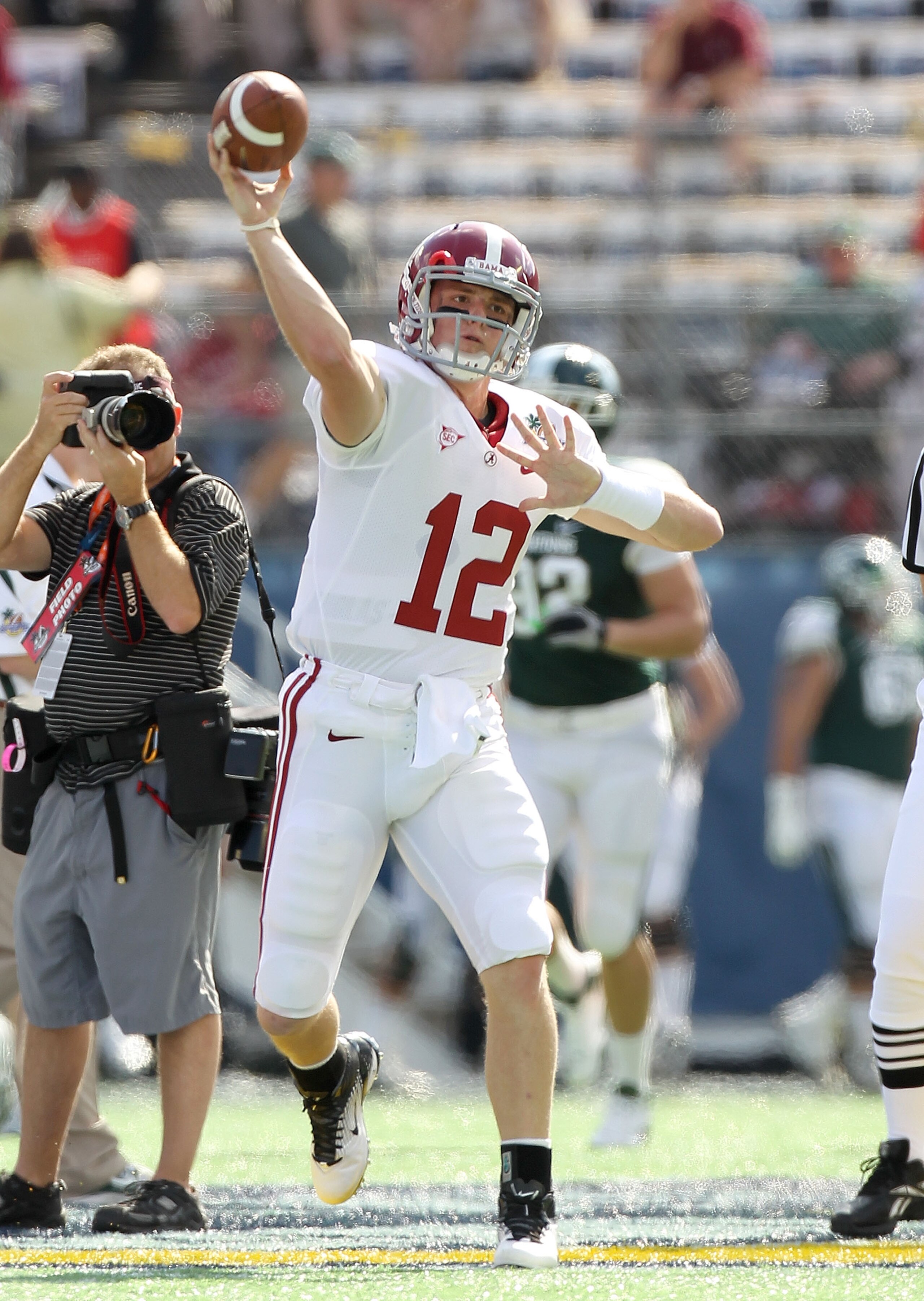 ORLANDO, FL - JANUARY 01: Greg McElroy #12 of the Alabama Crimson Tide warms up during the Capitol One Bowl against the Michigan State Spartans at the Florida Citrus Bowl on January 1, 2011 in Orlando, Florida.  (Photo by Mike Ehrmann/Getty Images)