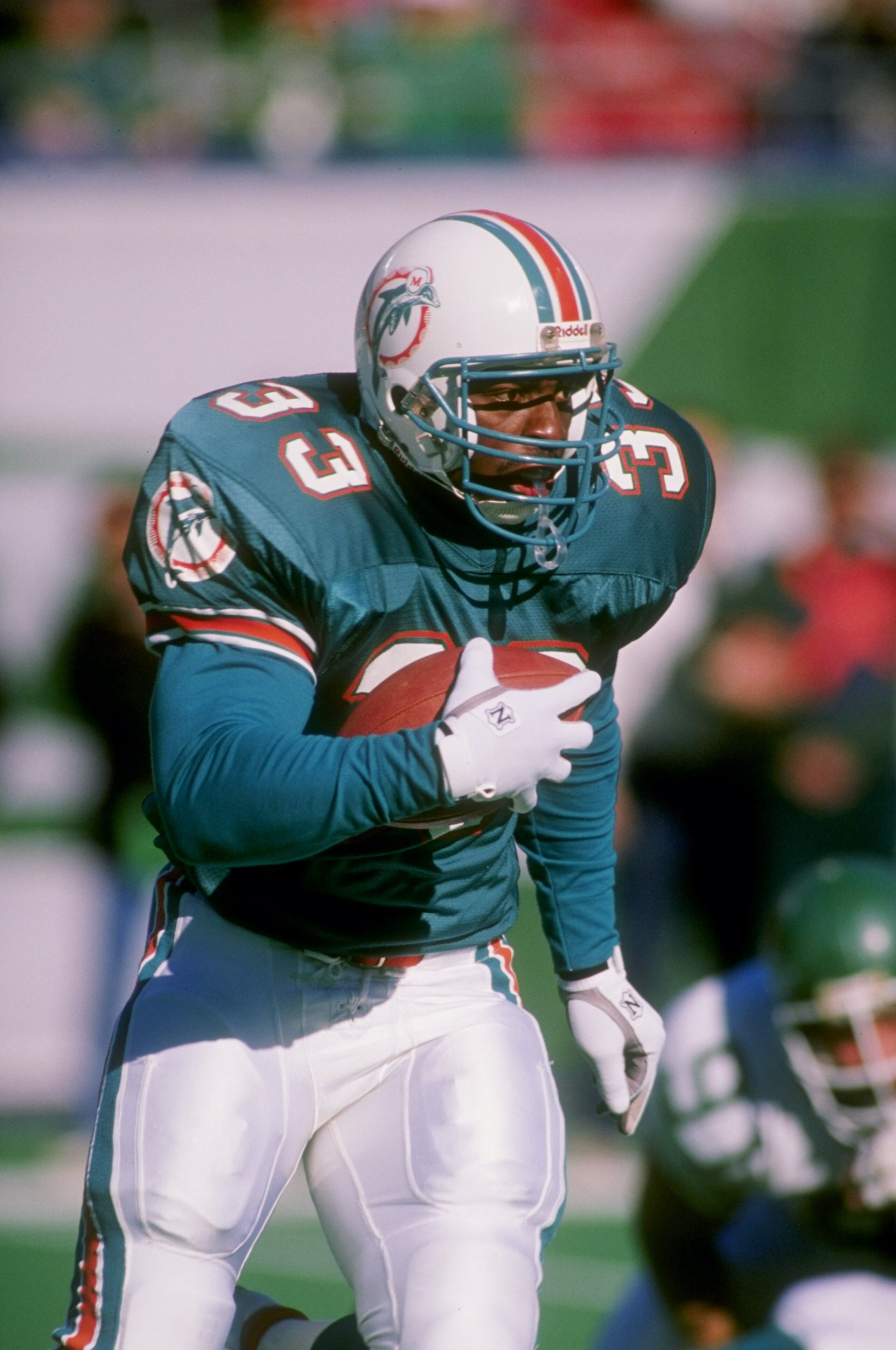 1989-1990:  Running back Sammie Smith of the Miami Dolphins runs with the ball. Mandatory Credit: T. G. Higgins  /Allsport