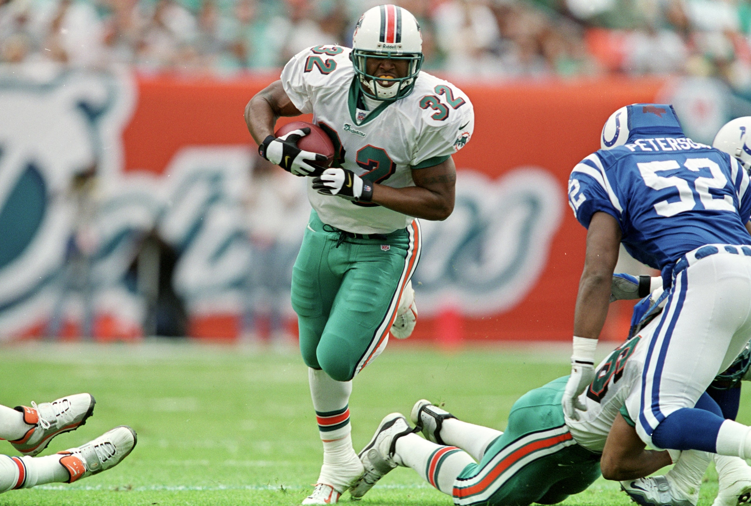 5 Dec 1999:  J. J. Johnson #32 of the Miami Dolphins carries the ball during the game against the Indianapolis Colts at the Pro Player Stadium in Miami, Florida. The Colts defeated the Dolphins 37-34. Mandatory Credit: Andy Lyons  /Allsport