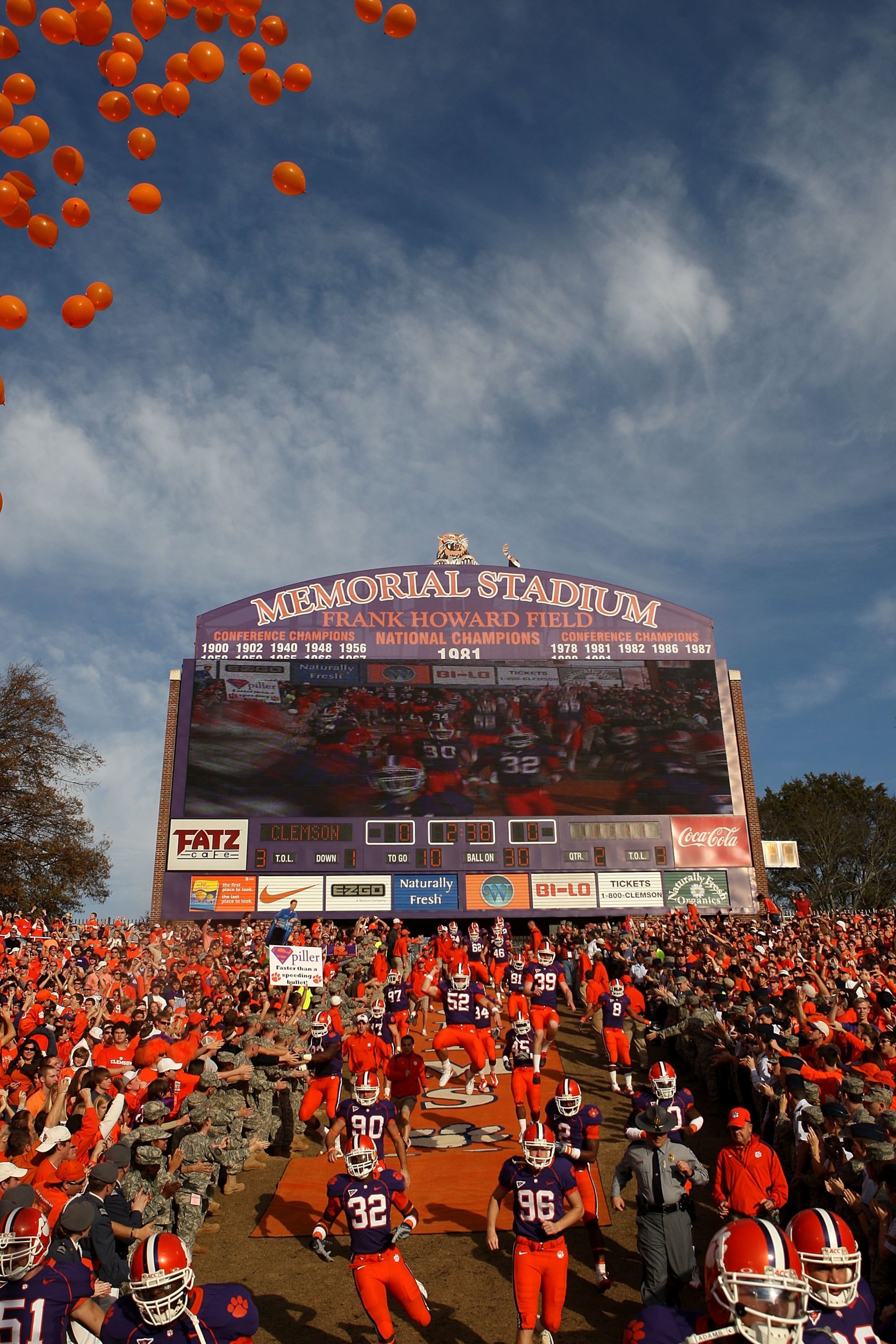 CLEMSON, SC - NOVEMBER 21:  Clemson Tigers players run onto the field with the scoreboard in the background before the game against the Virginia Cavaliers at Memorial Stadium on November 21, 2009 in Clemson, South Carolina. (Photo by Streeter Lecka/Getty