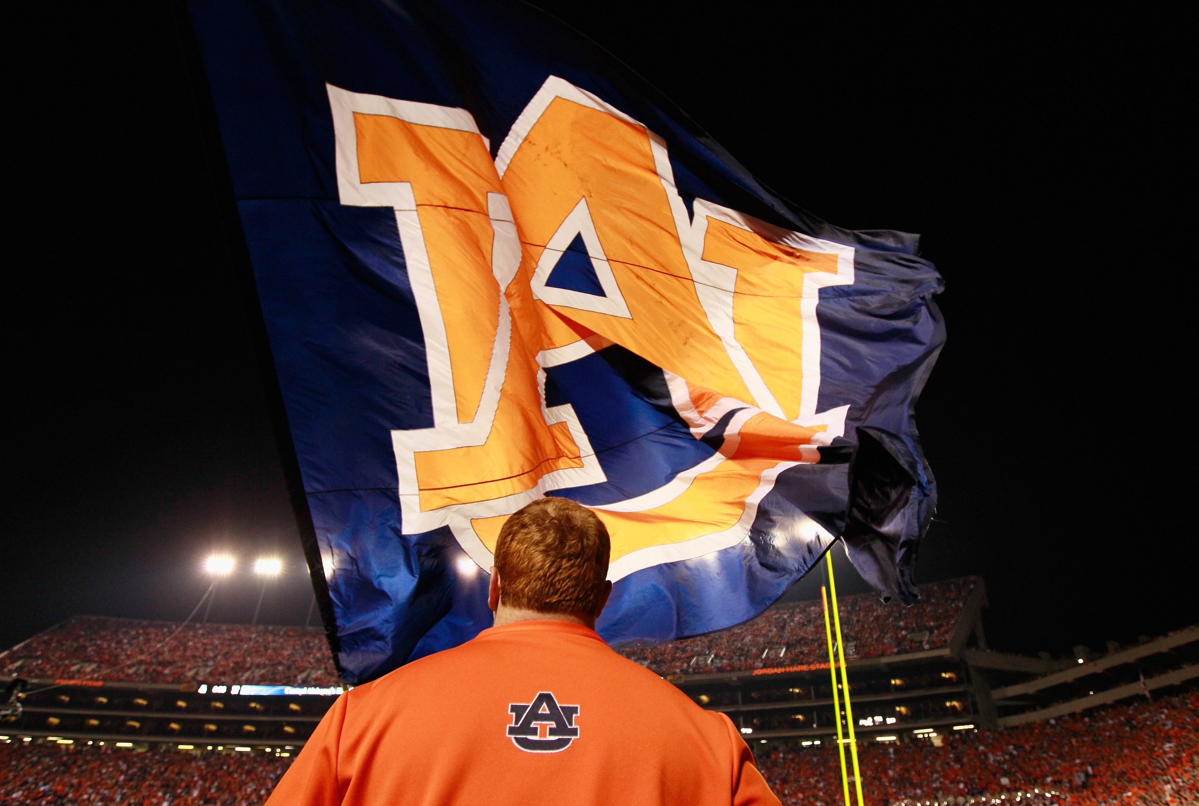 AUBURN, AL - NOVEMBER 13: Cheerleaders of the Auburn Tigers wave one of their giant flags against the Georgia Bulldogs at Jordan-Hare Stadium on November 13, 2010 in Auburn, Alabama. (Photo by Kevin C. Cox/Getty Images) AUBURN, AL - NOVEMBER 13: Cheerleaders of the Auburn Tigers wave one of their giant flags against the Georgia Bulldogs at Jordan-Hare Stadium on November 13, 2010 in Auburn, Alabama. (Photo by Kevin C. Cox/Getty Images)