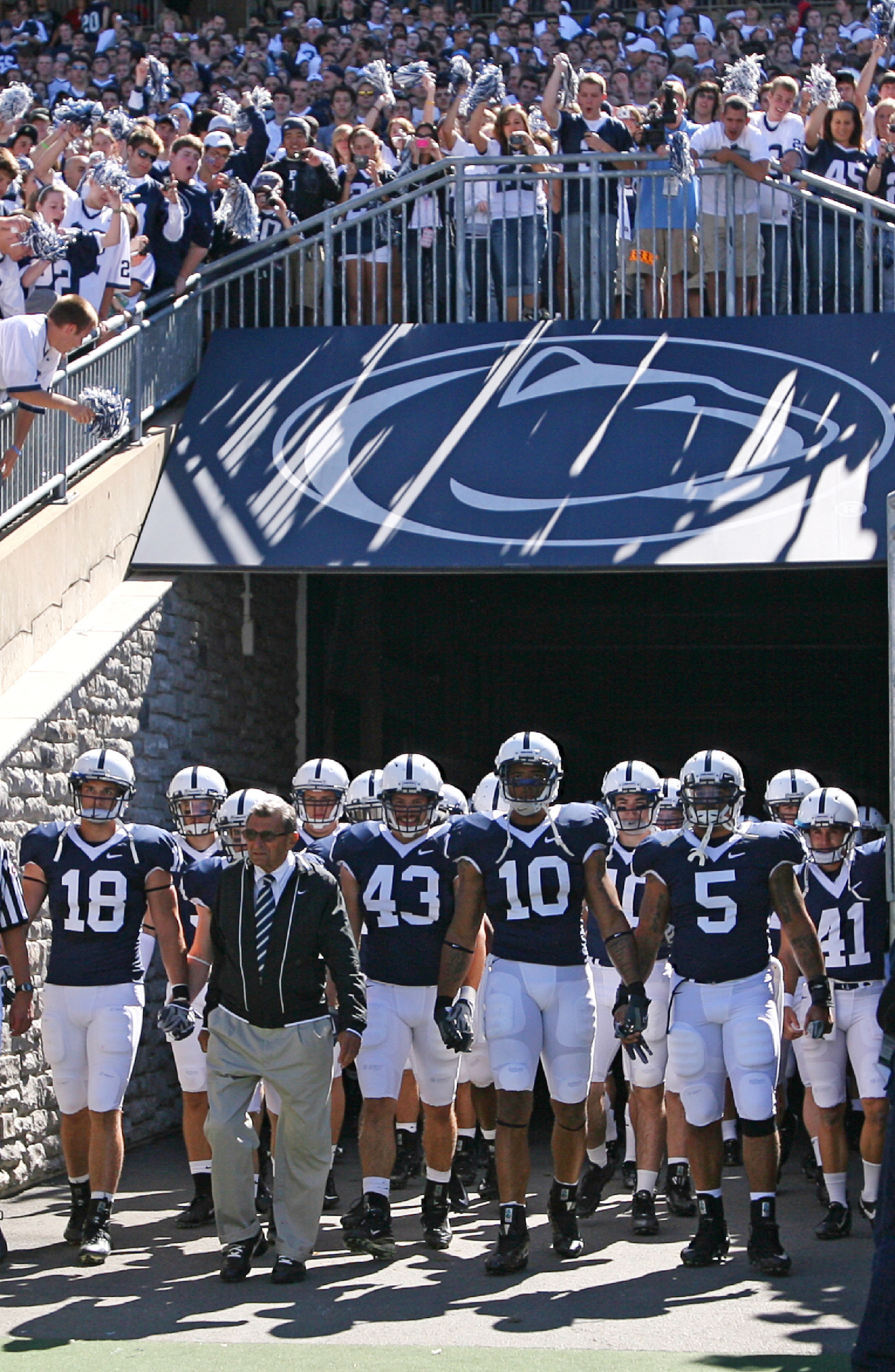 STATE COLLEGE, PA - SEPTEMBER 19: Head coach Joe Paterno of the Penn State Nittany Lions leads his team onto the field before a game against the Temple Owls on September 19, 2009 at Beaver Stadium in State College, Pennsylvania. (Photo by Hunter Martin/Ge