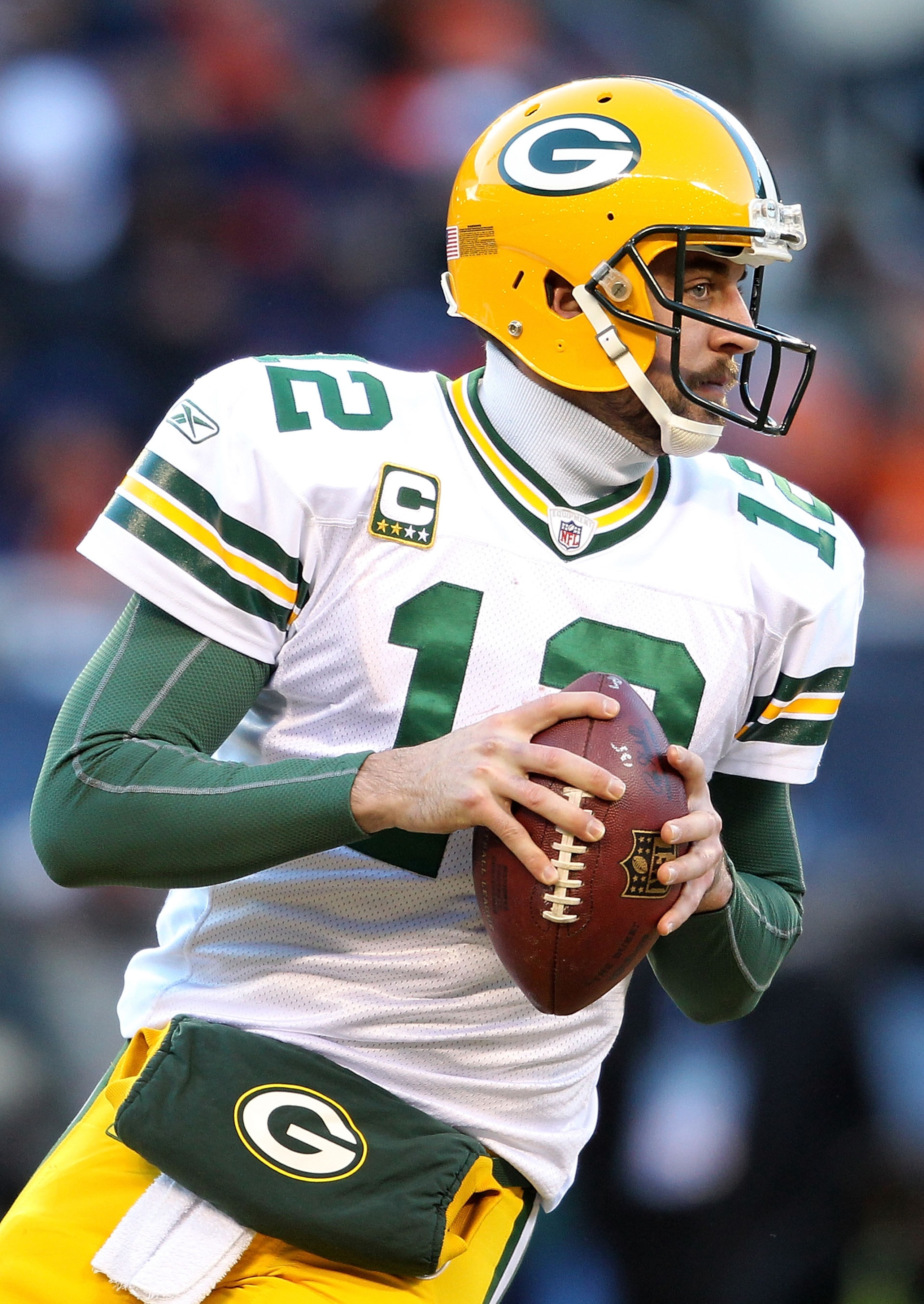 CHICAGO, IL - JANUARY 23:  Quarterback Aaron Rodgers #12 of the Green Bay Packers looks to pass against the Chicago Bears in the NFC Championship Game at Soldier Field on January 23, 2011 in Chicago, Illinois.  (Photo by Andy Lyons/Getty Images)