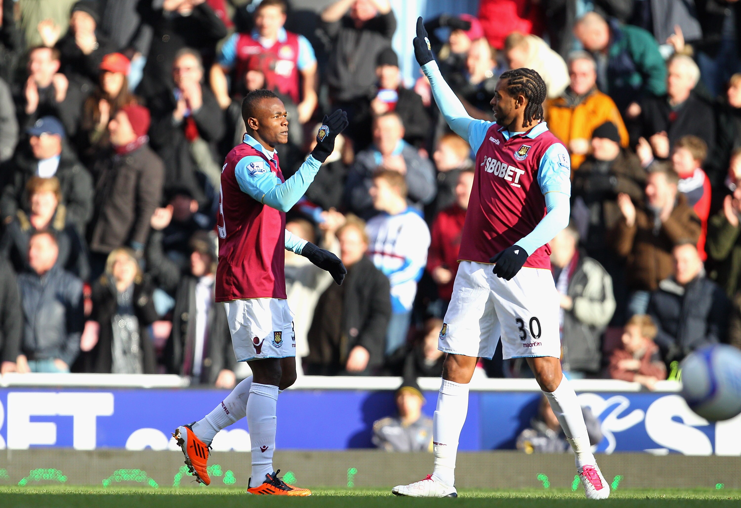 LONDON, ENGLAND - JANUARY 30:  Victor Obinna of West Ham United celebrates scoring the opening goal with teammate Frederic Piquionne (R) during the FA Cup sponsored by E.O.N 4th Round match between West Ham United and Nottingham Forest at the Boleyn Groun